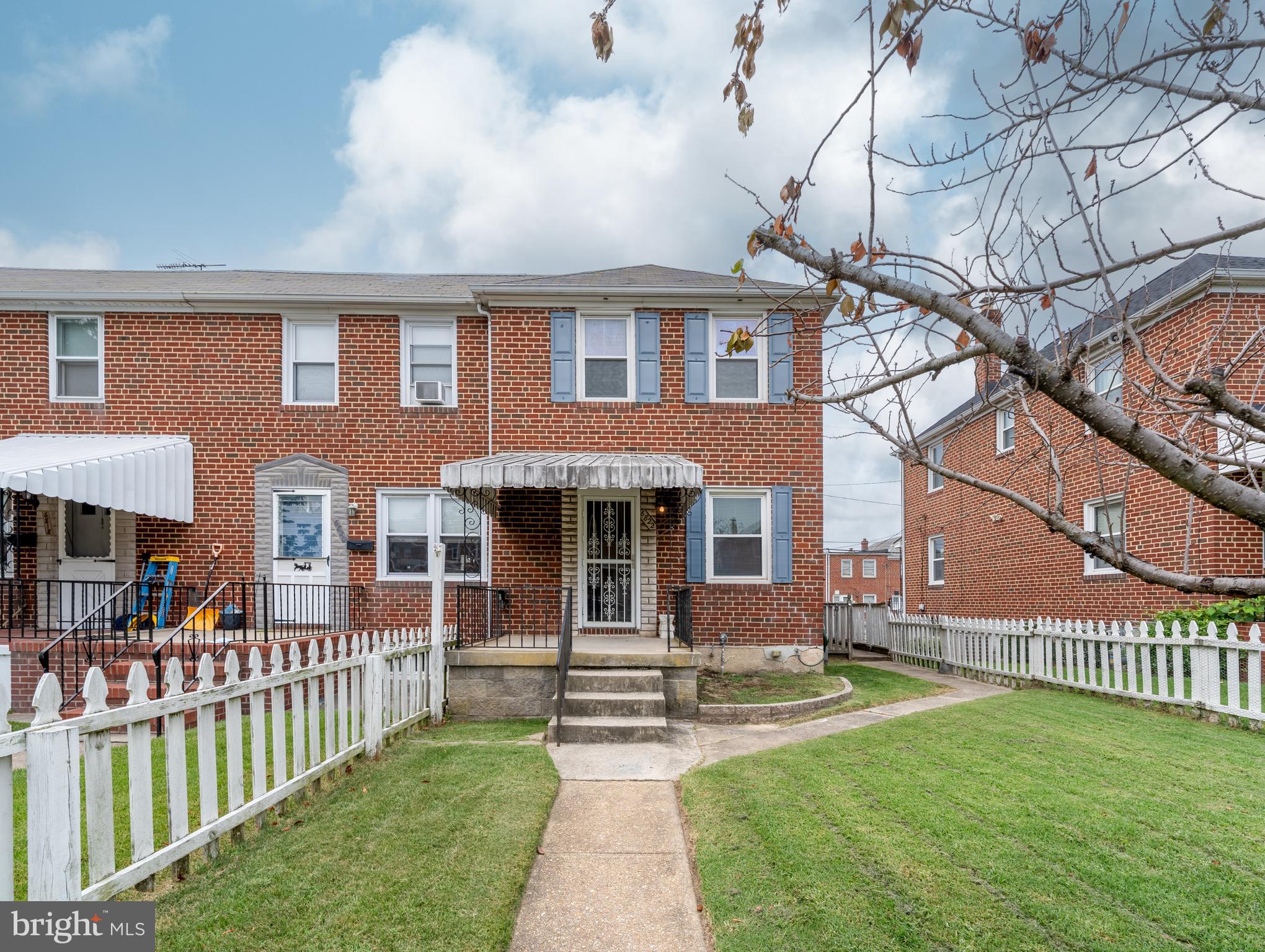 Beautifully Updated End-Unit Townhome in Graceland Park. This stunning all-brick end-unit townhome blends classic charm with modern updates and fantastic curb appeal. Nestled in the quaint Graceland Park community, the home features both front and rear covered porches, a fully fenced yard, and a private two-car driveway with rear alley access. A convenient shed offers additional outdoor storage. Inside, the home has been freshly painted and boasts wood flooring throughout the upper levels, as well as replacement windows and doors. The main level offers a bright, open-concept living and dining area—perfect for relaxing or entertaining. Upstairs, you’ll find three spacious bedrooms and a full bath. The fully finished lower level adds incredible flexibility, featuring a large recreation room with closet ideal for movie nights, game days, or use as a fourth bedroom or guest suite. A second full bath, a generous utility room, laundry area, and ample storage complete this level. Don’t miss this move-in ready gem in a charming neighborhood!