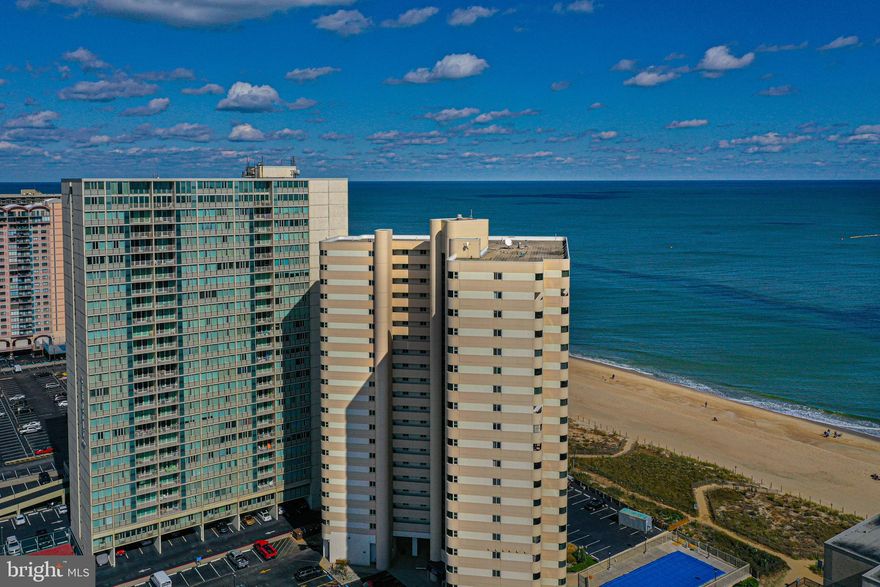 Experience Coastal Living at the sought out Direct Ocean Front Building the Atlantis Condominium.  Enjoy the views of the Ocean from the balcony with Over-sized windows!  So let the sunshine in, while enjoying the sweet salty breeze.  Spacious Primary bedroom features an amazing view of the Ocean, time to relax and unwind.  Bathroom has a Nice beach vibe, granite vanity top.  Living room offers a Nice open floor plan, perfect to relax and entertain while enjoying the Ocean Views.  Kitchen is equipped with granite counter tops, custom cabinet and stainless-steel appliances and convenient breakfast bar.  Nautical themed decor and color palate set the tone for good beach vibes.  Second bathroom has a convenient built in shower shelf, and granite vanity top.  Washer & Dryer.  This is a two-bedroom, two-bathroom condo that is move in ready!  The Atlantis Condominium has Onsite Security, and a year-round maintenance team contributes to the well managed building. Large well-maintained outdoor community pool, equipped with bathrooms and outdoor showers when you come off the beach, and pet area!! Condo fees included flood and hazard insurance plus WIFI and TV streaming.  This is just what you have been waiting for!  Excellent rental potential, or better yet keep it for yourself.  Live the good life you deserve, right here.