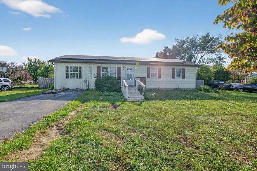 PRICE DROP-BRING OFFER!
Large fenced yard, rear deck with views, and room to update to your taste! 
Located in the Nadenboush community of Inwood, WV, this charming 3-bedroom, 2-bath ranch-style home offers more than just square footage. It delivers the kind of backyard views and quiet surroundings rarely found at this price point. 
The interior is filled with natural light and features a practical floor plan that includes carpeted bedrooms, a ceramic-tiled bathroom with a Corian vanity top, and a generously sized kitchen with ample cabinetry and workspace. There's clear potential to add value through modern updates, making this an excellent opportunity for buyers who aren't afraid of a little vision and elbow grease.
The home includes an attached carport, paved driveway, and a large fenced yard that backs to open land, offering privacy and room to roam. Outdoor spaces include a covered front porch and a private rear deck — both ideal spots for morning coffee or evening sunsets. While some cosmetic updates and repairs are needed, the home has been well cared for and provides a solid foundation for personalization.
Just minutes from I-81 and close to Martinsburg, this location offers quick access to shopping, restaurants, schools, and commuter routes, all while retaining a peaceful, rural feel. 
It's an ideal property for first-time buyers, downsizers, or investors looking for a manageable project with long-term upside.