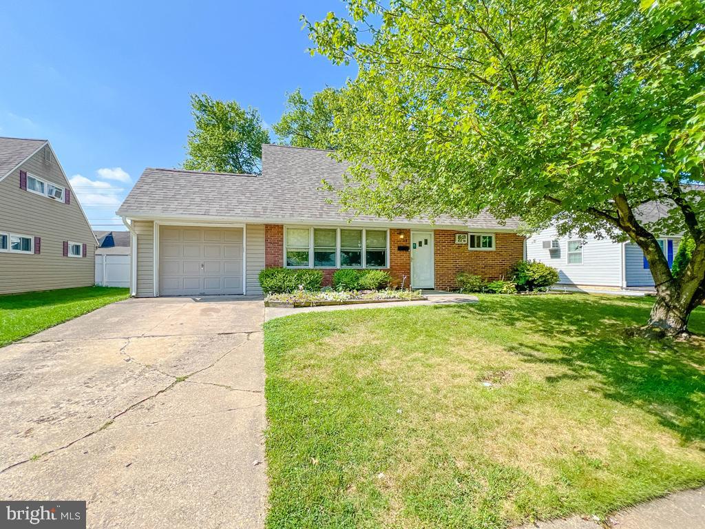 While sitting pretty with a newer roof and siding(2023), this Levittown Jubilee awaits new owners.
The  inside features plenty upgrades, as well. Newer luxury vinyl flooring, and cool and neutral tones just about throughout the entire first floor. This home has a well kept kitchen with an expanded dining area, living room, and an additional family room in the back. Laundry room is located off the family room and includes an addition toilet for convivence during nights of entertaining. That is a total of 2 and a quarter bathrooms. Also, the main bathroom shower has had a full make over with porcelain tile accompanied by a pedestal sink. No AC? No problem, the mini split keeps the whole first floor crisp all summer long. The garage features additional storage, workspace and built in cabinets for your avid hobbyist. Come check this well loved home and make it your own.