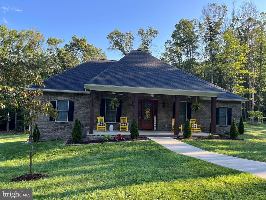 PEACEFUL PARK LIKE SETTING WITH HIGH SPEED INTERNET- Built in 2020 , this stunning French Country Inspired modern farmhouse offers, 2,100 sq. ft. of thoughtfully designed living space, plus full walk-out basement that can be finished to total  4,200 sq ft of living space.
The home features a bright open floor plan with four spacious bedrooms and 2.5 baths designed for comfortable living and effortless entertaining!
 The gourmet kitchen showcases custom maple cabinetry with pullouts, lazy Susans, built-in silverware tray, double trash storage, complemented by Cambria quartz countertops, a quartz sink, and Bosch dishwasher. 
 Throughout you will find Amorim cork flooring (100% waterproof), solid wood doors with lever handles, Amish-crafted ProVia entry doors, oversized Marvin windows, and an 8 Ft sliding door leading to rear porch and full-length vinyl deck.

Built with exceptional attention to health, durability, and indoor air quality, the home includes:

Whole-house RS4 air purification system with MERV filtration and UV light

Impressions Plus water softener system

DensArmor paperless drywall 

Healthy primers, antimicrobial paints, caulks, and sealants

 Sound-insulated interior walls and enhanced insulation

 All plywood construction Radon mitigation system with sealed basement

Additional features include 10 Ft ceilings in living and primary bedroom, 9 ft ceilings throughout the remainder, recessed lighting, 
Monte Carlo ceiling fans with remotes, 400 amp electrical service, PEX plumbing, and 50 year architectural shingles. 

Outdoor living is equally impressive with 8 ft deep covered porches with lighting and fans, plus a full length rear deck with Cali Bamboo composite decking. The property also includes a playset with rubber mulch and a 10 X 20 Amish-built shed with workbench. 

 Situated on 3.01 private wooded acres, this property offers exceptional privacy and peaceful natural surroundings, allowing you to enjoy wildlife and mountain serenity from the front porch and expansive back deck.

Perfect for remote work or modern living, high speed fiber internet provides fast, reliable connectivity for work and streaming !
Take advantage of this rare opportunity to own a high-quality, health-conscious home in a private natural setting .

COME DISCOVER BEAUTY AND TRANQUILITY !