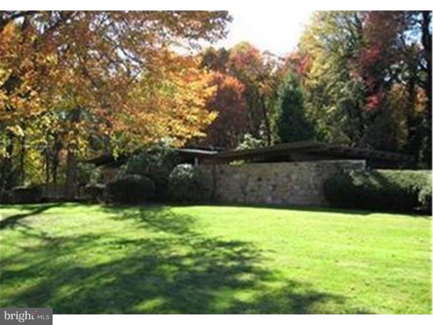 This contemporary home is nestled on 3+ acres of land?When location meets architecture?It gives us this beautiful Frank Lloyd Wright inspiration ranch in the east Penn School District less than a mile away from the Lehigh Valley Hospital, all major Routes 309/100 and I-78, across from the Lehigh Country Club. Privacy seeker, this home is for you, the main level has a double sided fireplace separating both dining and living room, the open kitchen lets you enjoy the natural light with the wall of windows going throughout the back of the house with scenic view. All 4 bedrooms have its own bathroom. The lower level has the open concept and wall of windows as well, a stone full service wet bar, a large great room, and a wood fireplace waiting for great memories to be made.