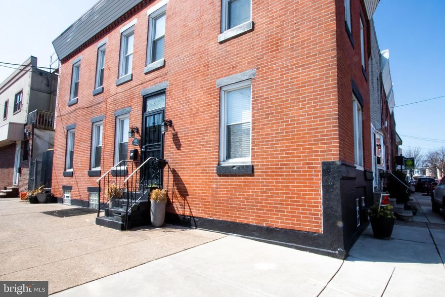 This sunny corner property in the heart of South Philadelphia Girard Estate section is move in ready. With 3 well maintained bedrooms and 1.5 bathrooms, this bright and spacious home is perfect for families of all sizes. It features high ceilings, shiny hardwood floors, and a spacious open floor plan with direction. The newly renovated kitchen showcases stainless steel appliances, granite countertops, modern tile backsplash, and ample storage space. The second level features 3 bedrooms, a finished bathroom, and a wide hallway. This home is conveniently located within walking distance to South Philly's Stephen Girard Park, bars, breweries, and other attractions, including GAMP.  It is also in close proximity to I-76, and SEPTA'S Broad St. line and bus lines, making your commute a breeze.