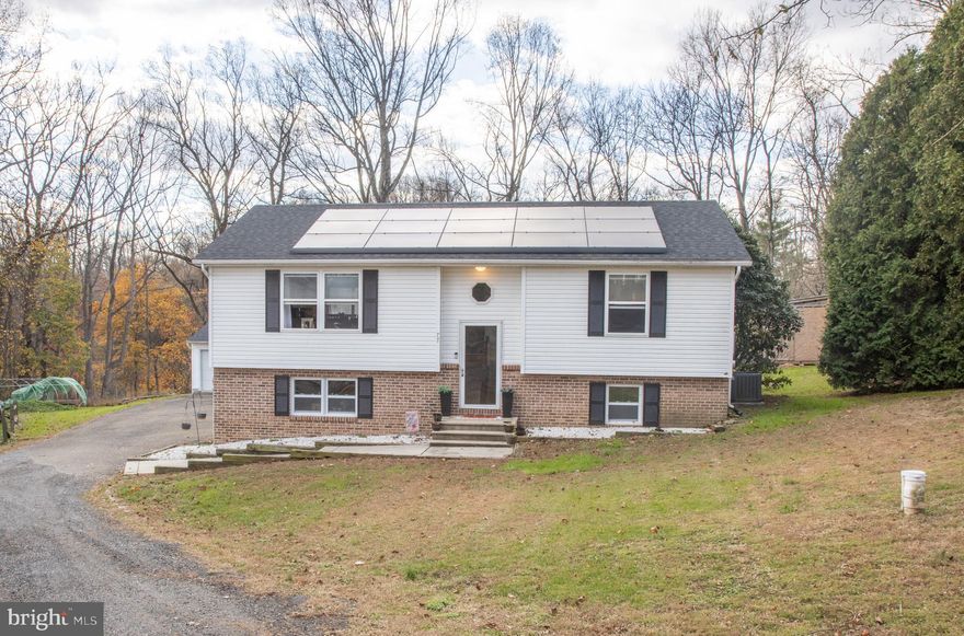 Welcome to 77 Martin Rd, Conowingo, MD 21918!This move-in-ready gem was completely remodeled less than 2 years ago and still feels brand new! Fresh updates include new luxury vinyl plank flooring throughout the main level, new roof, new cabinets, quartz countertops, stainless steel appliances, new water heater, and beautifully tiled bathrooms. The open-concept layout flows effortlessly from the bright living area to the gourmet kitchen with huge island and out to the spacious deck overlooking your private backyard – perfect for entertaining or quiet evenings .Cozy carpeted bedrooms upstairs, plus a versatile lower level with three additional bedrooms/flex rooms, family room potential, and plenty of storage. The oversized detached 3-car garage is a rare bonus – ideal for vehicles, workshop, or hobby space. All this in a peaceful setting, yet minutes from schools, shopping, and commuter routes. Modern luxury, practical space, and turn key condition – don’t miss it!