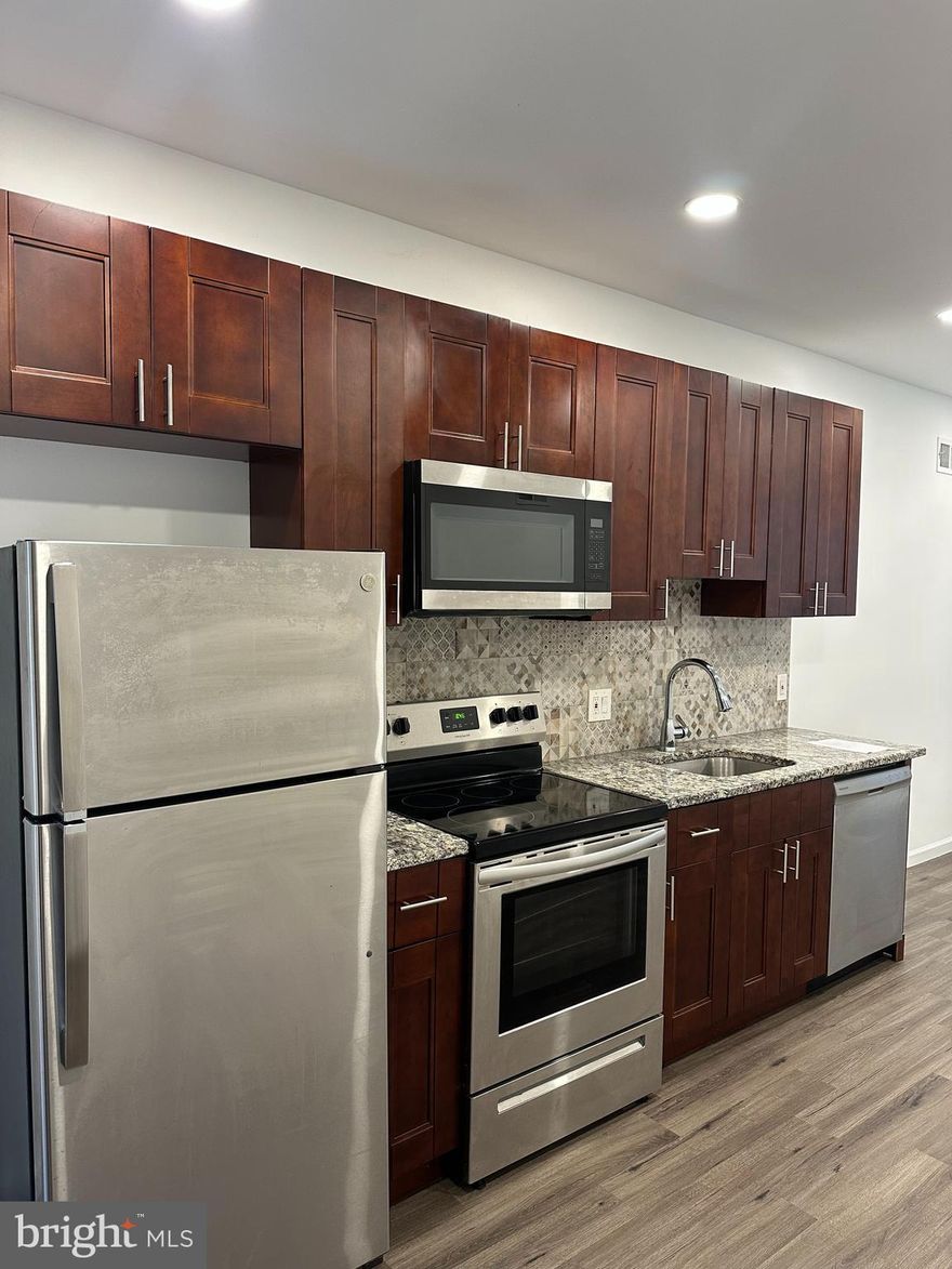 This lovely recently fully rehabbed duplex  is located minutes away from Center City. Features custom designed kitchen, granite countertop, central A/C, dishwasher and all brand new stainless steel appliances with laundry hook-up. Second floor unit is occupied by tenant. First floor unit is bi-level with access to a backyard and  currently vacant. Collect rent and live for free, don't worry about repairs as everything is brand new.