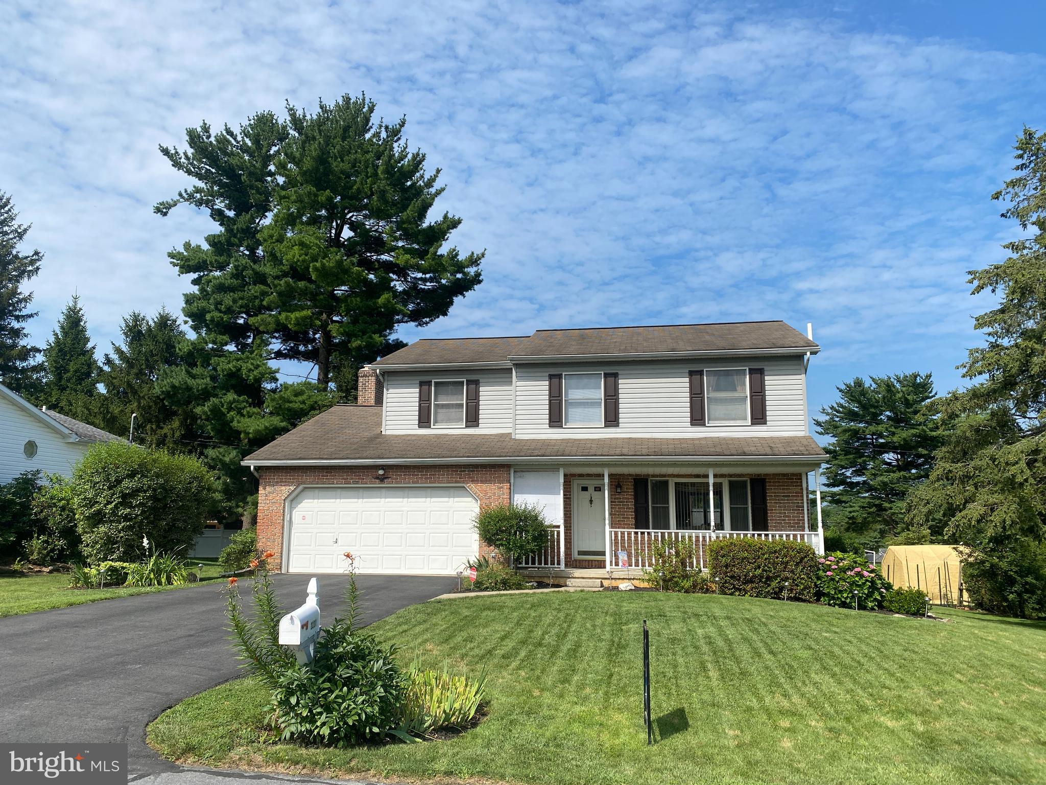 This classic two-story brick front Colonial has been well cared for and maintained by the current owners. Recent improvements include a heat pump with comfortable central air and hot water heater both installed in 2022. The entire first level plus the staircase has glowing hardwood floors throughout for easy maintenance. Flexible 1st floor plan as formal living room opens to the formal dining room and the generous eat in kitchen is open to the family room. Focal point in the family room is the all brick wood burning fireplace. The 2nd floor has four generously sized bedrooms including the 19x12 primary suite which features an ample walk-in closet and attached full bath. A full basement and two car garage provide plenty of storage space. Enjoy the outdoors from the raised sun deck or extend the electric retractable awing for comforting shade. The rear yard is nicely sized but easily maintained. Entire property has thoughtful landscaping with blooms scheduled throughout the year. There is even a fenced in vegetable garden ready for you. Covered front porch is also usable as a quiet area to relax. Located in the peaceful and popular Miller Heights section of Bethlehem Township which has no cumbersome deed restrictions allowing you to enjoy your property to its fullest. Yet location still offers easy access to parks, St Luke's Anderson Campus, numerous shopping centers and the 33/78 corridor. Home has a clear Bethlehem Township certificate of occupancy and is ready for you.