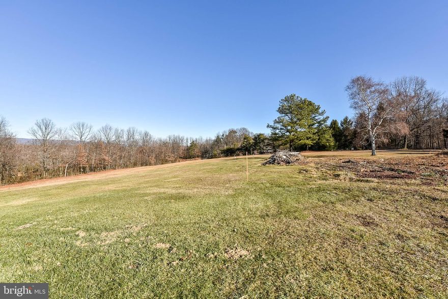 NO HOA! 3 Unrestricted Acres with gorgeous mountain views!  Electric, well and septic system on site.
Large outbuilding with electric, currently used as for storage and a wood shop. Buyer to do own due diligence.