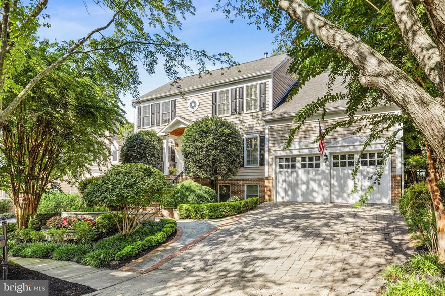 Presenting this timeless five-bedroom, three-and-a-half bath Colonial that blends classic architecture with fresh updates and exceptional indoor-outdoor living. Set in Alexandria’s sought-after Quaker Hill neighborhood, the home enjoys quiet, tree-lined surroundings with easy access to Metro, shopping, the community pool, and more.
Inside, an airy two-story foyer opens to formal living and dining rooms, hardwood floors, and a main-level study. The renovated kitchen is a showpiece, outfitted with chef-grade appliances, abundant counter space and custom cabinetry, while the adjacent great room soars with high ceilings and oversized windows that bathe the space in natural light. Upstairs, the primary suite offers a spa-like bath with soaking tub, separate shower, and a custom walk-in California Closet. Three additional bedrooms and one hall bath complete the upper level.
The lower level is designed for entertainment and versatility, with full windows, a media room with built-ins, a light-filled game or exercise room, a full entertainment kitchen, bedroom, and bath—perfect for guests or multi-generational living.
Step outside to a private outdoor setting designed by McHale Landscape, with stone patio, built-in grill, sink, and cabinetry complemented by integrated lighting. The fenced lawn and thoughtful hardscaping create an inviting retreat, while the irrigation system and landscape lighting make upkeep simple.
One block from the HOA pool and near a scenic pond with greenery, this home offers convenience, elegance, and everyday comfort in one of Alexandria’s most welcoming neighborhoods.
