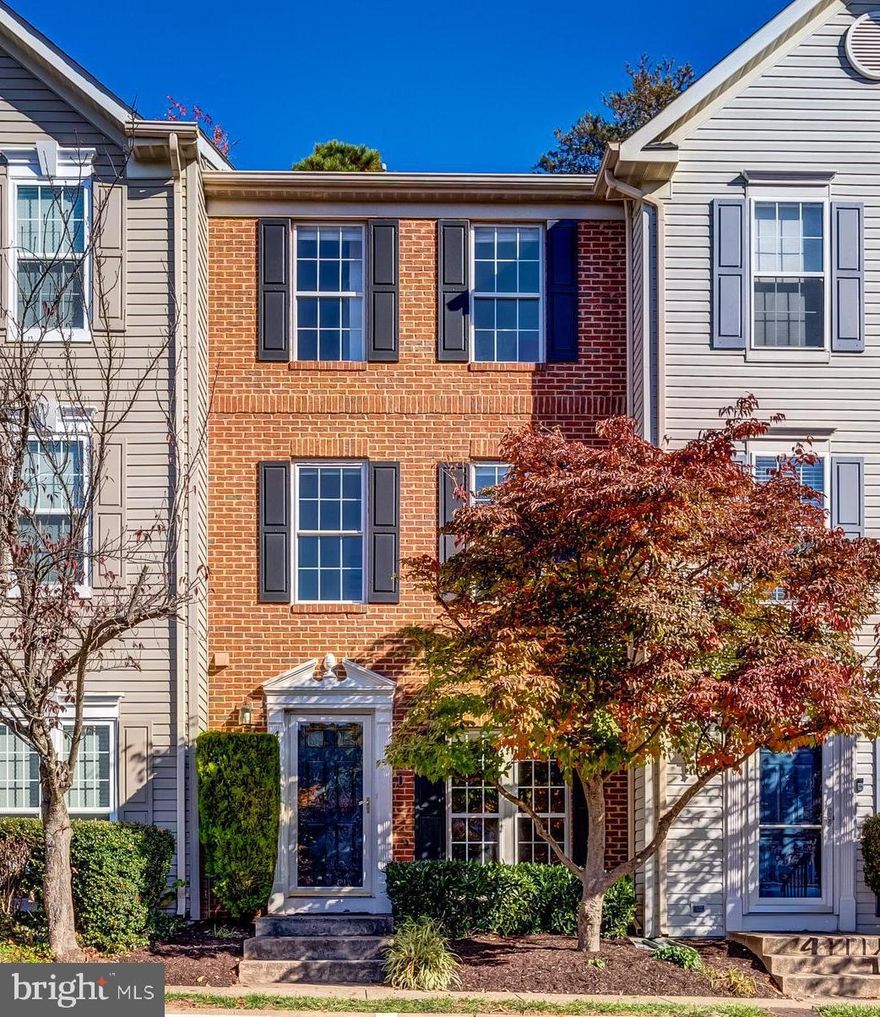 Discover the perfect blend of contemporary style and everyday practicality in this exquisite townhouse, nestled in a prime location close to Fair Oaks Mall, Government Center, and GMU. This home is not just about comfort; it's about a lifestyle. With easy access to a variety of restaurants, a movie theater, and community amenities including a swimming pool & gym, you are at the center of convenience. Step into the welcoming ambiance of the living room, where the rich texture of hardwood floors and the subtlety of neutral paint create a perfect backdrop for your personal decor. The heart of this home is the elegantly upgraded eat-in kitchen, boasting refined granite countertops, high-end stainless steel appliances, and a stylish subway tile backsplash. The functional island and the adjacent breakfast room, with durable tiled floors, ensure that style and practicality coexist harmoniously. A spacious pantry not only provides ample storage space but also cleverly houses the laundry area, keeping your home organized and streamlined. The inviting patio, just off the kitchen, is a tranquil retreat where you can unwind, surrounded by the peacefulness of a tree-backed private area. The first upper level unfolds into a spacious family room, warmed by a gas fireplace - an ideal setting for both relaxation and social gatherings. This floor also houses a generously sized bedroom with a private full bathroom, offering comfort and privacy for guests or housemates. Ascend to the top level to find the crown jewel of this home: a vast primary suite with soaring ceilings and a luxurious bathroom, designed for ultimate relaxation and privacy. Parking is a breeze with your own assigned space and additional guest spaces available, as well as dedicated EV vehicle charging stations. This modern townhouse is not just a place to live; it's a lifestyle choice for those who value comfort, convenience, and a touch of luxury.