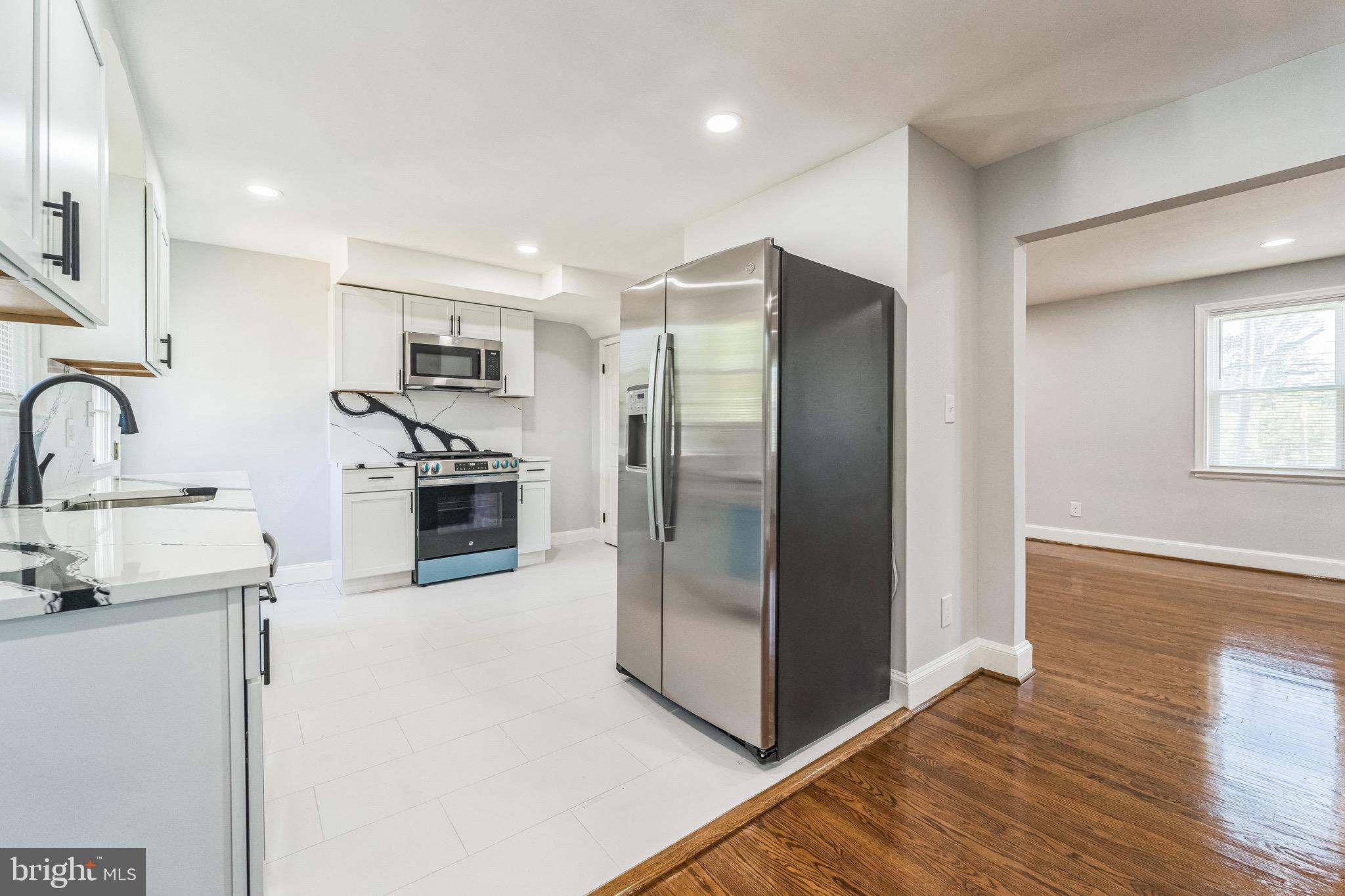 Beautifully renovated home with quality material and workmanship. Not to be missed! Home features include newly refinished hard wood floors through out and lot of natural light. Complete renovated kitchen with quartz countertops and stainless appliances. Fully finished lower level with a room and full bath. This home is equipped with mini-splits cooling system which are generally more energy-efficient than traditional central air systems, and allows for more independent temperature control.