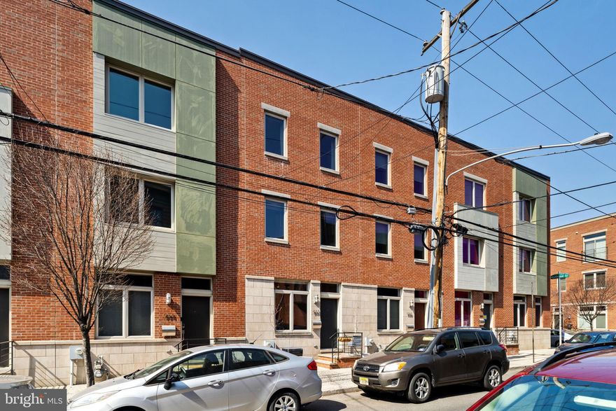 Welcome to 932 South 8th Street in the private Mildred Court Residential Private Community. A stunning and thoughtfully upgraded residence offering an exceptional blend of space, style, and convenience in the heart of Bella Vista. This expansive home features three bedrooms, three full bathrooms, and approximately 2,700 square feet of living space, including a fully finished basement. Situated on a generous 17’ x 50’ lot, the property includes a private patio, a spacious roof deck with city views, and the added convenience of assigned parking right outside your door! 

The first floor boasts a highly functional layout, designed to maximize natural light and create a seamless flow between the living, dining, and kitchen areas. The current owners have made significant enhancements, including the installation of wide-plank real hardwood floors throughout, custom cabinetry for additional storage, and upgraded kitchen cabinets and select new appliances.

The second floor offers two spacious bedrooms, each with exceptional space and abundant natural light. One of the bedrooms features an en-suite full bathroom, while an additional full bathroom is conveniently located in the hallway. This well-designed layout ensures privacy and comfort, making it ideal for families or guests.

The primary suite serves as a private retreat, featuring a spacious bedroom, a luxurious en-suite bathroom with an oversized stall shower and double vanity, and two expansive walk-in closets—each large enough to accommodate a full dresser, ensuring ample storage space!

The finished basement provides incredible versatility with high ceilings and ample space, making it perfect for a home gym, office, or play area. All utilities have been recently serviced, ensuring efficiency and peace of mind for the next homeowner.

There are so many perks about the area in which this home resides. Located within the desirable Nebinger School Catchment and benefits from low HOA fees of just $206 per month. Conveniently located just one block from the iconic Italian Market and within minutes of some of Philadelphia’s finest dining, shopping, parks and playgrounds, this home offers an unparalleled lifestyle in one of the city's most vibrant neighborhoods. This is a rare opportunity to own a beautifully updated residence with modern amenities and a prime location.