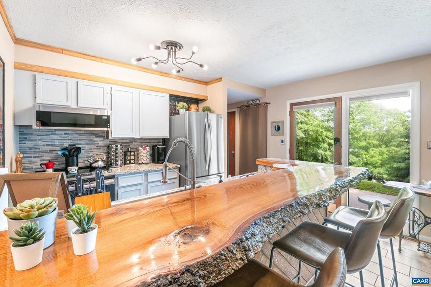 Step into a beautifully transformed contemporary condo where heated floors throughout create ultimate comfort. Located in one of the most sought-after mountain destinations, this fully renovated 1-bed, 1-bath gem offers everything you need for year-round enjoyment?whether you?re seeking the perfect weekend escape or an investment property.  Relax after a day of outdoor adventure with the luxury of heated tile floors, providing warmth and comfort during colder months.  A stunning centerpiece in the kitchen, this unique bar invites you to sit back and enjoy the beauty of natural wood craftsmanship. Featuring sleek granite countertops, modern updated appliances, and an open layout?perfect for both casual meals and entertaining.  Unwind in the custom bathroom with its impressive floor-to-ceiling tile work, offering a true spa-like experience in the comfort of your home.  Stay cozy all year with an efficient heat pump and bi-polar air purifier, plus enjoy the ease of smart home features that make living here both convenient and comfortable.  Whether it's skiing in the winter, hiking in the summer, or biking in the fall, this prime location offers endless outdoor activities right outside your door.  Schedule a showing today!,Granite Counter,Fireplace in Family Room