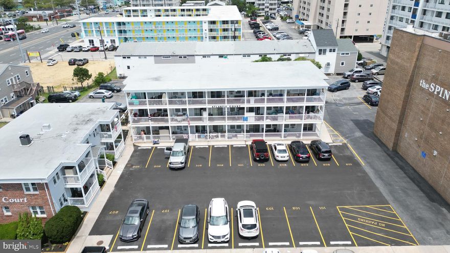 Just one building back from the Ocean and Beach on 72nd street is Atlantic Court! Featuring 2 bedrooms, 1 1/2 bath, private and spacious  outdoor porch, washer/dryer in unit and fully furnished! This condo has an incredible weekly rental history for all investors. The owners have renovated both bathrooms, the kitchen and new flooring throughout and are leaving the condo fully furnished so the new owners will be rental ready as soon as they take over! Per condo association in 2015: new wooden stairs and common walkways, new vinyl railings, porches rebuilt and vinyl siding. 1 car assigned parking.