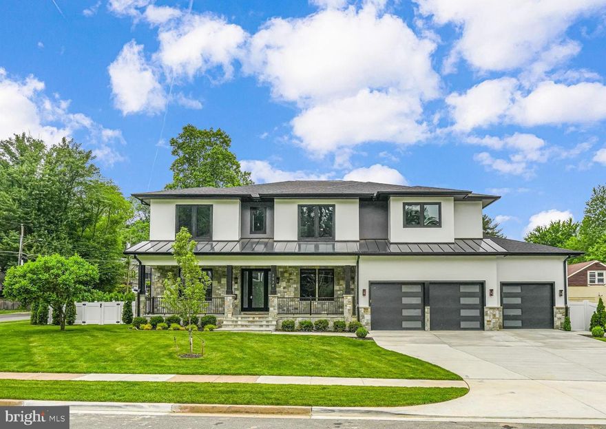 NEW QUALITY CONSTRUCTION HOME IN FALLS CHURCH with a spectacular location between Tysons and Mclean. Step into luxury and modern sophistication in this newly constructed masterpiece. Spanning over approximately 7,500 square feet, this home is a statement of transitional and contemporary elegance, offering a seamless blend of bold architectural features and inviting warmth.

The main level welcomes you with an abundance of natural light, showcasing suspended ceilings, stained hardwood floors, and a versatile bedroom/office with a private full bath. The heart of the home is the Chef’s Kitchen, adorned with Quartz countertops, high-end appliances, and a generous pantry, while the stone-covered porch off the breakfast room provides a serene retreat.

Upstairs, the luxurious primary suite beckons with dual walk-in closets, a private balcony, and a spa-like en-suite. Two additional en-suites with private baths, two bedrooms sharing a full bath, and a laundry room complete this level.

The walk-up lower level is an entertainer’s dream, featuring a show-stopping signature Quartz bar, a spacious recreation room, a bedroom and full bath, a media room and another room. 

Outside, the professionally manicured yard, the covered stone front porch, the fenced in yard, and the attached 3-car garage add to the allure of this exceptional property.

This home is a testament to meticulous craftsmanship and modern luxury, offering a lifestyle of unparalleled comfort and style. Don't miss the chance to indulge in the pinnacle of modern living!