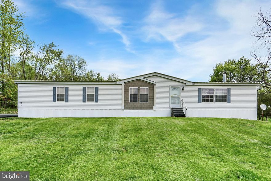 Super spacious double wide sits on .52 acres and features oversized master bedroom with master bath and large soaking tub, living room dining room and large eat-in kitchen with center island. Fireplace is brand new and was never used but would easily heat most of this home..   Home was recently converted to public sewer (all paid in full by seller) and  is sitting on 42 pillars and held down with 20 hurricane straps. (Seller originally bought this with a VA financing).  The well is located in shed in backyard.