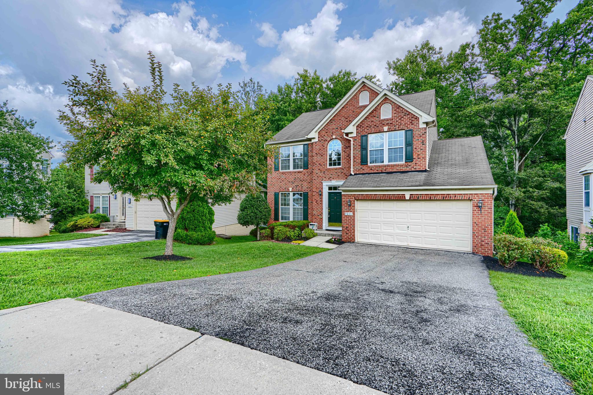Situated in the Lennox Park community of Elkridge, this elegant brick-front Colonial at 7211 Lyndsey Way offers over 2,100 square feet of beautifully updated living space. The spacious 4 bedroom, 3.5 bath layout features fresh paint and new flooring on 1st floor and a gourmet kitchen that opens to a light-filled living area. The home extends to a cozy family room and a rear deck—ideal for relaxing or entertaining. Upstairs, the luxurious primary suite includes dual vanities, a Jacuzzi tub, and a separate shower, while the fully finished basement provides versatile space for a home office, media room, or guest retreat. With a two-car garage and close proximity to major commuter routes and the Dorsey MARC station, this rare Howard County gem blends comfort, convenience, and neighborhood charm.
