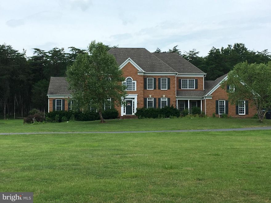 Beautiful Five Bedroom, Four full baths colonial home on a private 6-acre lot. 3 Gas fire places, gourmet kitchen, Master bedroom with luxury bath. New paint, New kitchen and New SS appliances. Fully finished basement, attached two car garage. Absolute privacy.