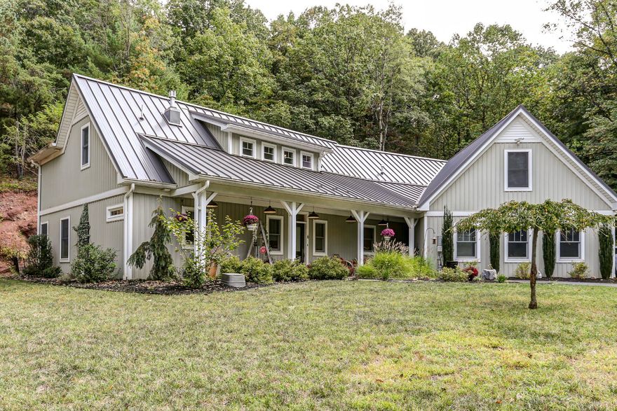 Welcome Home to an exceptional custom‑built residence at 6 Maple Grove Road, where refined craftsmanship meets breathtaking natural beauty. Set on nearly four private acres, this thoughtfully designed home offers spectacular views and a seamless blend of elegance, comfort, and flexibility.
Upon entering, you are greeted by a light‑filled, open‑concept living space encompassing the family room, dining area, and kitchen—ideal for both everyday living and entertaining. The family room features soaring vaulted ceilings, abundant natural light, and a warm, inviting fireplace. The adjacent dining area is framed by expansive windows, providing serene views of the surrounding landscape and wildlife.
The gourmet kitchen is a true centerpiece, appointed with generous counter space, granite countertops, stainless steel appliances, a farmhouse sink, and a convenient pot filler—perfect for the discerning home chef. Just beyond, you’ll find a spacious walk‑in pantry, a stylish half bath, and an oversized laundry room complete with a dedicated dog‑grooming station. This area also provides access to the oversized two‑car garage, which houses the home’s data and mechanical systems and a whole‑house generator.
Designed for multigenerational living or guest accommodations, the private in‑law suite offers its own living room, dining area, and a beautifully finished kitchen with granite countertops and ample cabinetry. The suite includes a comfortable bedroom, a full bathroom, and a versatile bonus room that can serve as a home office or walk‑in closet.
The upper level continues the home’s thoughtful layout, featuring an additional bedroom and full bathroom. At the center of the floor is a bright, open office or study space with built‑in workstations for two—ideal for remote work or homeschooling—overlooking the main living areas below. Beyond the office, a kitchenette leads to two finished bonus rooms, offering endless possibilities such as additional bedrooms, a gym, craft space, private offices, or future bathroom expansion.
Outdoor living is equally impressive, with a welcoming front porch showcasing panoramic views and a screened‑in rear patio accessible from both the main residence and the in‑law suite—perfect for enjoying peaceful mornings or evening gatherings.
This exceptional property offers a rare combination of luxury, functionality, and adaptability in a tranquil setting. Experience your own private sanctuary—schedule a private showing today to fully appreciate all that this remarkable home has to offer.