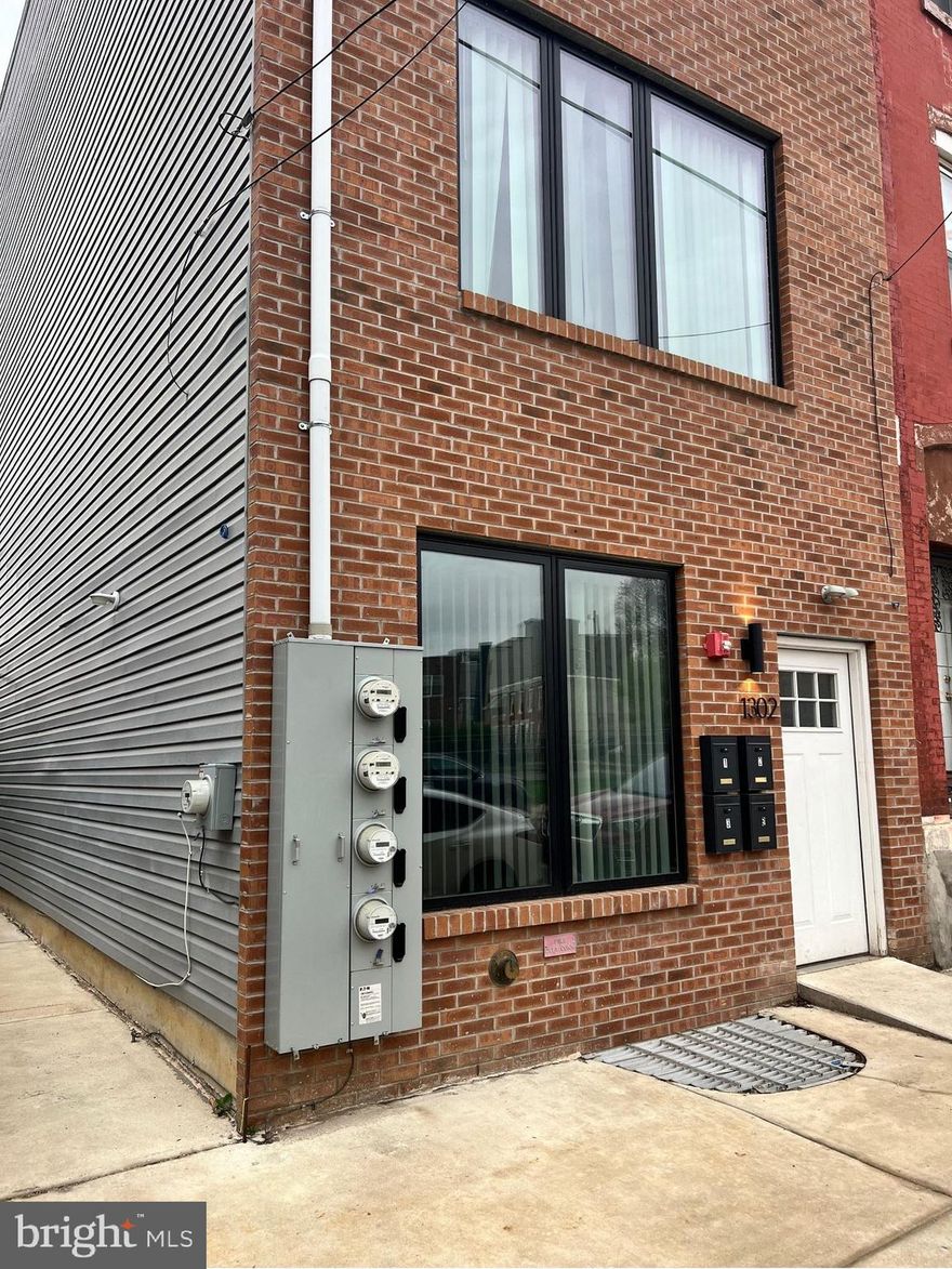 Welcome into your ground level, one bedroom, one bathroom apartment! Opening into a sun-drenched kitchen with granite countertops, black subway tile backsplash, and stainless steel appliances, the built-in shelving and window bench provide convenience and storage. Access the in-unit, top-load washer and front-load dryer in the sliding-door hallway closet. The living area is situated between the kitchen and rear patio-facing bedroom, beside the ADA-compliant bathroom. Tenant access to common rear patio space. No gas bill! Schedule your tour today!