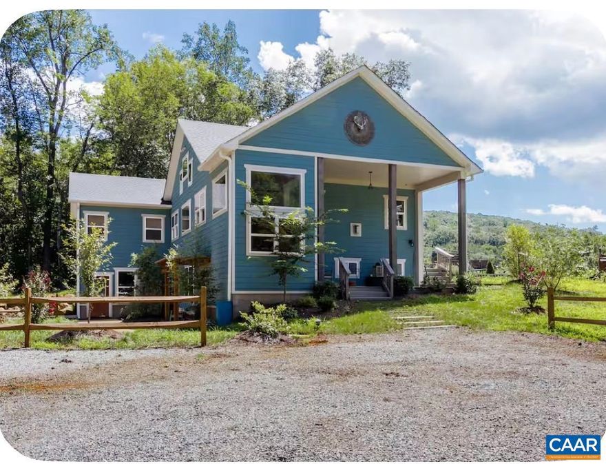 Set on over 20 private acres just minutes from Charlottesville and Wegmans, this exceptional property offers breathtaking mountain views and a rare combination of craftsmanship, comfort, and convenience. The main residence, built in 2015, features over 3,000 finished sf with 3 bedrooms and 2� baths. This stunning white oak timber frame home was thoughtfully designed and custom-built with beams hand-selected by the owner, who brings over 45 years of experience in the timber industry. The home offers true one-level living with an open floor plan, soaring ceilings, abundant natural light, and beautiful oak flooring throughout. A striking cherry bar and custom gas fireplace mantel?crafted from a tree sourced directly from the property?create a warm and inviting focal point. The spacious kitchen features quality cabinetry by Cabinets by Design. Outdoor living is equally impressive, with expansive deck space overlooking nearly level land, a koi pond, a spring-fed duck pond, and a firepit?all framed by sweeping mountain views. Additional improvements include a barn (approximately 52? x 16?), an outbuilding with a separate electric meter, and a charming guest house w/full bath, loft and private deck.  Convenient access to Rt 29 and I-64,Granite Counter,Fireplace in Living Room