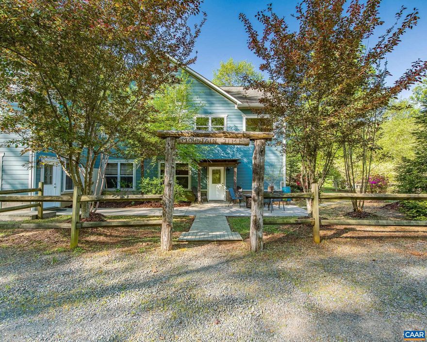 Set on over 20 private acres just minutes from Charlottesville and Wegmans, this exceptional property offers breathtaking mountain views and a rare combination of craftsmanship, comfort, and convenience. The main residence, built in 2015, features over 3,000 finished sf with 3 bedrooms and 2� baths. This stunning white oak timber frame home was thoughtfully designed and custom-built with beams hand-selected by the owner, who brings over 45 years of experience in the timber industry. The home offers true one-level living with an open floor plan, soaring ceilings, abundant natural light, and beautiful oak flooring throughout. A striking cherry bar and custom gas fireplace mantel?crafted from a tree sourced directly from the property?create a warm and inviting focal point. The spacious kitchen features quality cabinetry by Cabinets by Design. Outdoor living is equally impressive, with expansive deck space overlooking nearly level land, a koi pond, a spring-fed duck pond, and a firepit?all framed by sweeping mountain views. Additional improvements include a barn (approximately 52? x 16?), an outbuilding with a separate electric meter, and a charming guest house w/full bath, loft and private deck.  Convenient access to Rt 29 and I-64,Granite Counter,Fireplace in Living Room