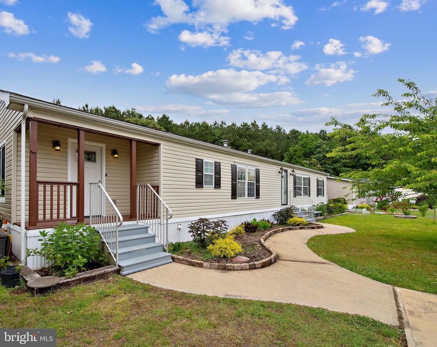 Located in the quiet community of Hebron Woods you will find this spacious 2300 sq ft home that sits on a private partially wooded lot with almost an acre of land. Home features 3 Beds, 2 full baths and a large bonus room- easily accessible from the front and the back of the home!  
HIGHLIGHTS: Open Floor Plan with Vaulted Ceilings, Large Bedrooms, Massive Kitchen, Walk in Pantry, Dedicated Spacious Laundry Room, Covered Porch (front and back), Shed, Play house, Huge Backyard,
Deck (large enough for hot tub), Food Forest: (Fruit trees: Plum, pear, fig, pawpaw, pomegranate, hazelnut, & 4x berry bushes) and Vegetable and Herb Gardens (ready for harvest) Btw: YOU WILL BE PICKING BASKETS OF EXOTIC FRUIT THIS YEAR!! The ground rent of $375/month includes: Water and Sewer, Community Maintenance, Trash Removal, & Snow Removal. Enjoy NO PROPERTY TAXES when you make this home your own! Don't wait- see it for yourself today before its gone!!