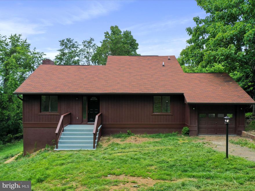 Welcome to your serene retreat in the desirable Loch Linden community! Nestled on a peaceful 1.8-acre lot, this beautifully renovated 3-bedroom, 2-bathroom home combines modern updates with rustic charm, all just a short walk to private lake access for swimming, canoeing, fishing, and picnics. Step inside to discover a bright, open-concept living area featuring luxury vinyl plank flooring, a cozy fireplace, and an updated kitchen boasting quartz countertops, a stylish backsplash, stainless steel appliances, and new lighting throughout. Enjoy seamless flow from the kitchen to the dining and family rooms, perfect for everyday living or entertaining. Both bathrooms have been tastefully upgraded with new tile showers, adding a spa-like touch. Downstairs, you'll find a spacious open area ideal for a game room, home gym, or second living space complete with a wood stove for extra comfort and charm.  New HVAC ensures peace of mind and energy efficiency. Step outside through sliding glass doors to a large deck, perfect for relaxing or taking in the tranquil wooded views. This is more than a home, it’s a lifestyle. Don’t miss your opportunity to own a turn-key getaway or full-time residence in one of Linden’s most peaceful lake communities!