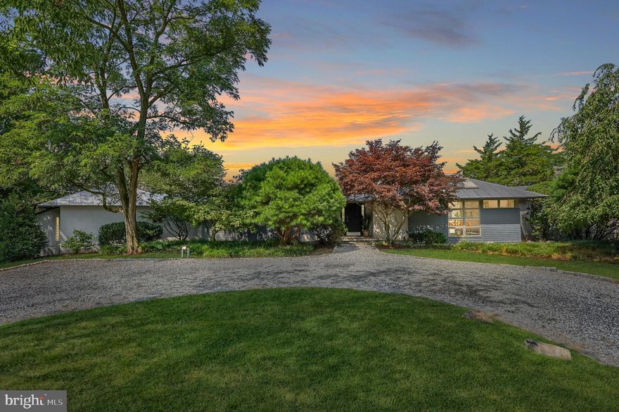 Welcome to your new contemporary oasis.  6993 Schoolhouse road exudes European charm coupled with 20 acres of plush, rolling hillside.  This 5 bedroom, 3.5 bath sprawling ranch-style home was designed by Danish Architect, Christian Hoirup.  This home is comprised of 4 separate wings; primary, kitchen/ family, dining/ entertaining, and children/ guest.  Common wings offer grand cathedral style ceilings, exposed beams, and Spanish inspired tile.  Each wing also accesses the multi-level deck that overlooks the pool area.   This property offers seclusion and various outdoor activities throughout the 20 acre grounds; Hike down to the creek through cleared paths, start a soccer game on the large flat yard, or relax poolside and enjoy the sounds of nature.  This home is truly one of a kind and only minutes from Downton Hershey & Hummelstown, Hershey Medical Center, and Hershey Attractions.  *New Driveway Lighting* Heated, In-Ground Pool* Newer Pool Liner* Newer Salt Water Spa* Professional Landscaping* Hardscape Rock Fountain* New Carpet* New Fixtures* New Well Pump & Water Treatment System* Metal Roof* Deck Restored & Repainted*