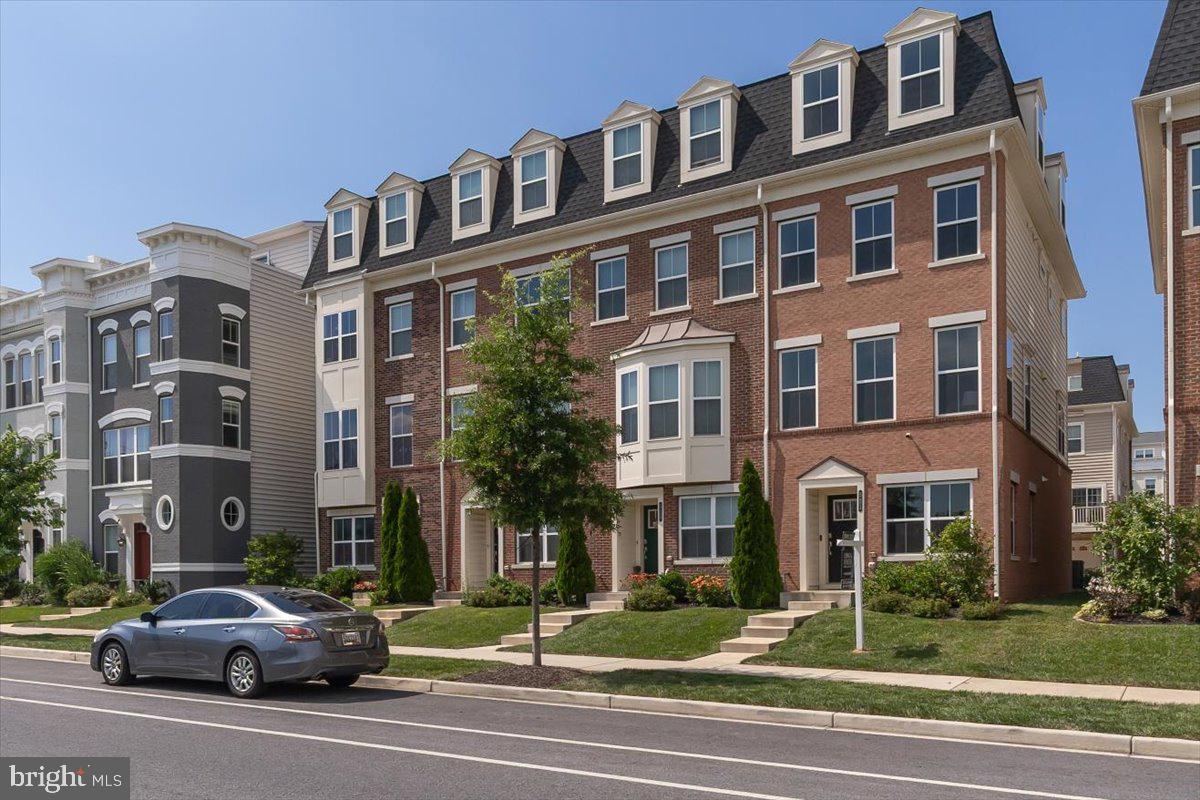 OPEN HOUSE - SUNDAY 7/6 - 1:30-3:30 pm. Welcome to 521 E 7th Street, a bright and modern end-unit townhome built in 2020, nestled in Frederick’s sought-after East Church community. Each floor is flooded with natural light and large windows. Two levels include sliders out to two separate living spaces. On the entry level you will find a wonderful flex space that could be used as an office, a family room, exercise room or playroom along with a 1/2 bath and foyer entrance from the garage. Head upstairs to the main living area which features an open concept design with a dining area, kitchen, 1/2 bath and living room. Here you will find modern luxury vinyl plank flooring, stainless appliances, granite counters, center island and large white kitchen cabinets. The high ceilings and recessed lighting add to the grandeur of this living space. Onto the third level which features the primary bedroom with ensuite bathroom and walk in closets. The primary bedroom offers a secluded private retreat after a long day. Down the hall you will find a washer/dryer combo tucked away in its own space while offering convenient access from the primary bedroom and a second bedroom with front facing views. Then head up to the 4th level which offers another great living space for just hanging out or second office along with access to a private balcony, full second bathroom and large private third bedroom. Upgraded interior tech includes a smart thermostat, smart panel with security features. Overall, 521 E 7th Street offers a harmonious blend of open, light-filled spaces, high-quality finishes, and modern intelligent features. This well-laid-out, four-level home is perfect for entertaining, urban living, and comfort and includes desirable amenities like the community pool, clubhouse and playground all within walking distance to downtown Historic Frederick!