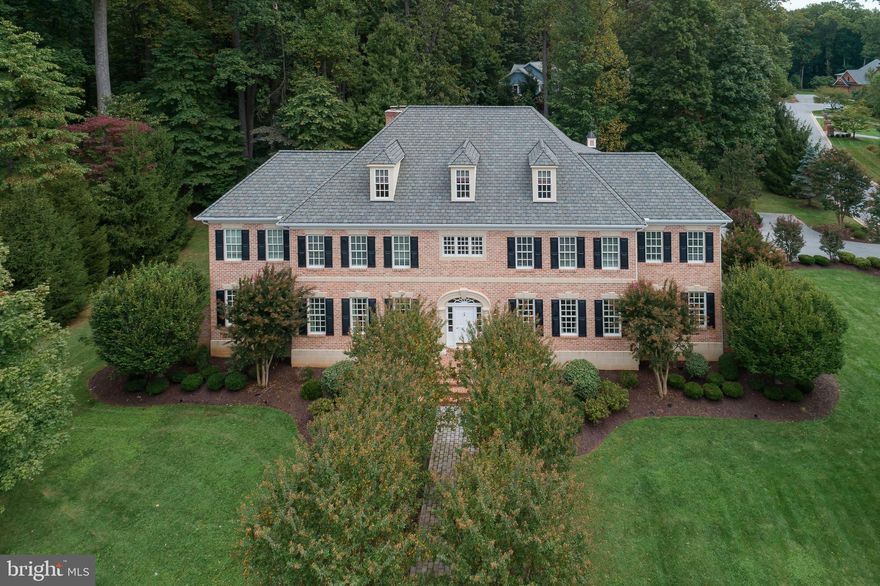 Timeless elegance and comfortable sophistication define this expertly designed Medford beauty.  An exquisite execution of quintessential Georgian Colonial architecture by Bement & Sons, this gorgeous all-brick manse exemplifies masterful design and precision craftsmanship throughout. The grand marble Center Hall illuminates some of the home's fines features: 10-foot ceilings, impressive millwork and elevator.  The Main Level offers generously-proportioned living spaces including a Sunroom, Study, 3 fireplaces, Family Room w/ coffered ceiling & attractive custom built-ins plus an expansive eat-in Kitchen w/ custom walk-in Pantry and Dry Bar. The Owners' Suite is it fit for royalty, boasting a handsome coffered ceiling and fireplace plus separate Sitting Room, beautifully appointed Dressing Room, his and her walk-in closet and a travertine spa Bath & Toilette.   The Third Level is truly a treat - offering  versatile uses as In-Law/Guest/Au-Pere Quarters, additional Gaming Space, Office/Crating space and more. An expansive, bright Lower Level offers a gorgeously-outfitted custom Home Theater and substantial Recreation Room with fireplace and Kitchenette.