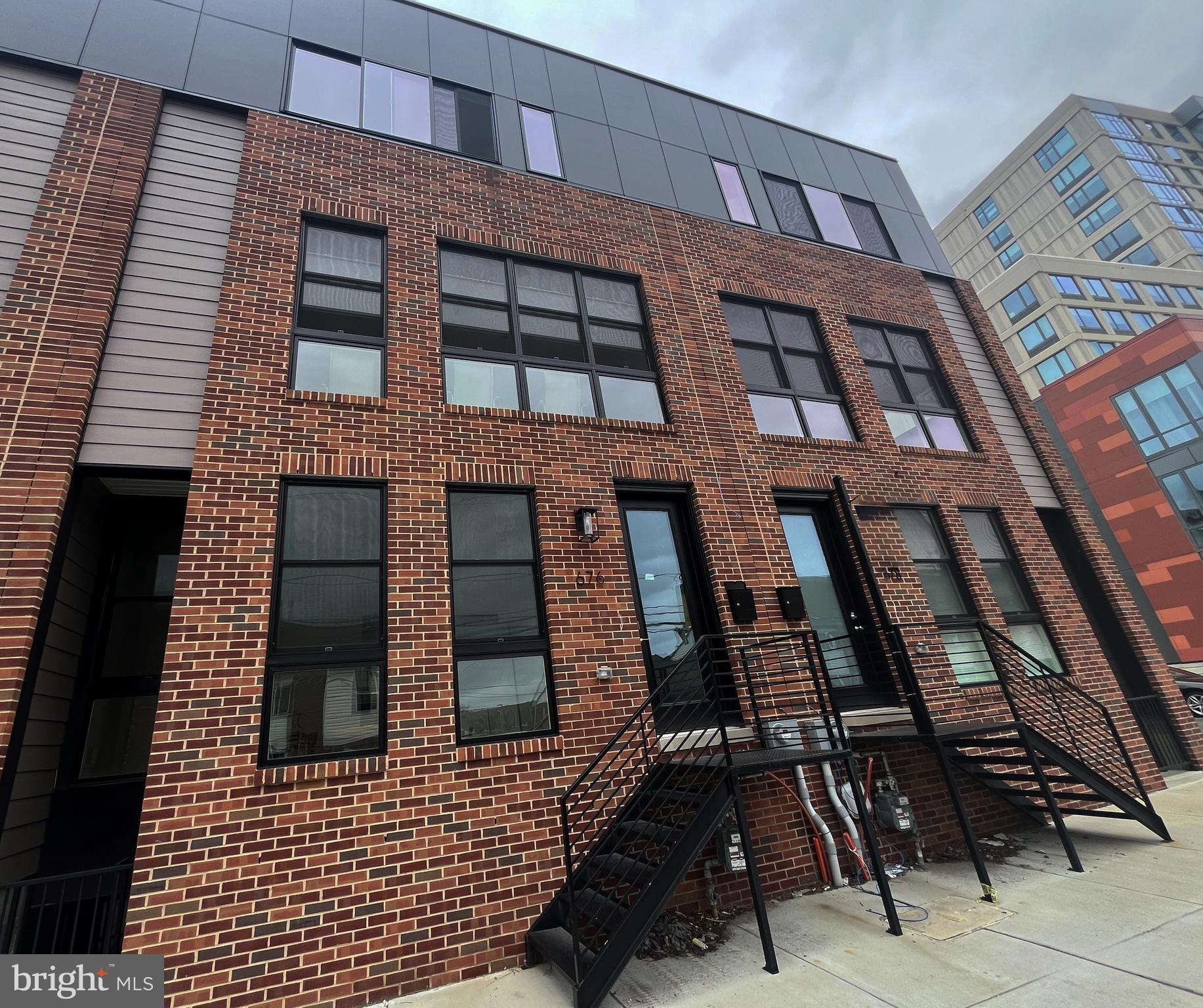 Welcome to this stunning end-unit townhome, newly constructed in 2024 and located in the highly desirable Spring Garden/Poplar neighborhood of Philadelphia. Offering approximately 2,540 square feet of stylish living space (per public records), this home perfectly blends modern design with everyday functionality. The first floor features an open-concept layout, seamlessly connecting the spacious living room, dining area, and gourmet kitchen—ideal for entertaining or relaxing with family and friends. Upstairs, you’ll find three generously sized bedrooms, each with ample closet space, and three full modern bathrooms. A fully finished basement provides additional flexible living space—perfect for a home office, gym, or media room. Additional highlights include: Covered driveway parking, Rear deck—ideal for unwinding after a long day. Prime location, just minutes from major roadways, public transportation, and local shopping and dining options. Don’t miss this golden opportunity to own a beautiful, move-in ready home in one of Philadelphia’s most vibrant communities. Schedule your private showing today!