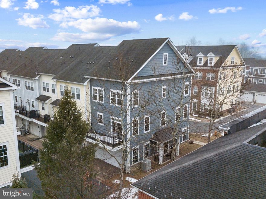 OPEN SUNDAY, MARCH 1ST: 2PM-4PM! This imposing upgraded end-unit townhome located in convenient Shipley's Grant is flooded with natural light and expansive views.  Located just a stone's throw from Shipley's Grant Shopping Center with every modern convenience, this elegant residence is turn-key ready.  The inviting layout offers an open floor plan complete with many different options for today's living; the main entry foyer boasts a recreation room or a combination office-guest room (4th bedroom); there's an oversized 2-car garage with all mechanical systems located in 2 closets inside the garage promoting a quiet living space; there is a private front open porch-patio area and a long deck off the kitchen; gas hot water, gas cooking, gas heat, electric central air conditioning and a gas living room fireplace are all affordable and attractive features.  The kitchen boasts a separate island for both prep work and seating; 42" high wood cabinetry abound with expansive granite counters and designer backsplash, stainless steel appliances and a huge table-space area for your kitchen table. The many large windows, fabulous wall spaces throughout for artwork and sculptures,  and recessed lighting compliment this lovely home.  The king-sized master bedroom sports a large closet, room for large furniture like dressers and desk and includes a master bathroom complete with garden tub, shower with large shower head, and tall dual vanity sinks, designer mirror and medicine chest.   The first 2 levels include hardwood and bamboo flooring while the bedroom level has new carpeting throughout.  An added highlight is the Samsung practically new washer and dryer conveniently located on the bedroom level.  Located in vibrant Shipley’s Grant, residents enjoy a walkable community atmosphere with amenities including a fitness center and club house, outdoor pool, party room and bike and jogging trails. Easy access and less than 5 minutes commute to I-95, Route 100, and Route 1;  shopping, dining, and everyday conveniences enhance the amenity-rich lifestyle.