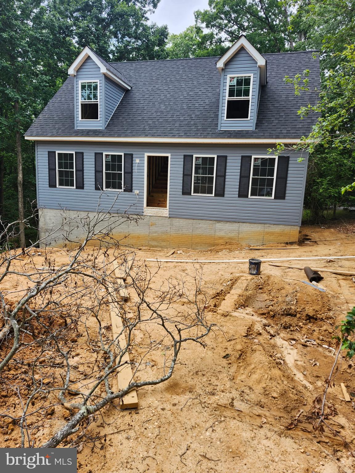 NEW CONSTRUCTION with July delivery!! Popular and modern Open Concept Cape Cod Design with 3 BR, 2.5 BA and full unfinished walk out basement. Bright kitchen with white cabinets, granite counters and plenty of storage space. All stainless-steel appliances. Open kitchen/dining/living area with separate mudroom and laundry area. First floor half bathroom. Entry level Primary Bedroom Suite with oversized walk-in closet. Primary Bathroom with double vanity sink, granite countertops and linen closet. Two bedrooms upstairs with additional full bathroom. Quality plank vinyl flooring and plush carpet throughout home. All granite countertops. New homes in this private waterfront community are in high demand and sell fast!! Do not miss this opportunity to buy a BRAND-NEW home in Chesapeake Ranch Estates. Home is close to the back entrance of community. Close to Patuxent River Naval Air Station and an easy commute to Washington DC or Annapolis. Community amenities include sandy beaches, freshwater lake, airpark, campground, hiking trails, athletic fields, snow removal, community clubhouse and security. Lusby Town Center within mile of community offers nearby groceries, restaurants and shopping. Please note: Photos are of a previously build home of the same model. Exterior color maybe different, interior color and finishes will be similar.