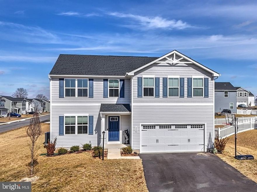 Welcome to the Cardinal Pointe Community and the best of both worlds; a Hedgesville address and a Martinsburg/Spring Mills/Falling Waters location.  Newly built in 2023, your new home is “move-in ready.”  When you arrive at 338 Otero Lane, you will notice that your new home sits on a huge corner lot.  The premium lot is just one feature that sets this home apart and is waiting for spring flowers, cookouts, and outdoor time with family and friends.  As you enter your new home, you will notice recent updates that include brand new carpet and fresh paint.  A two-car garage provides plenty of parking with space for additional storage. Inside, the open concept includes a sprawling great room that adjoins a gourmet kitchen with a large island that overlooks the dining area.  A first-floor office completes the spacious downstairs.  When it's time to unwind, head upstairs to your beautiful primary suite which features a luxurious dual-vanity bath and two walk-in closets!  In addition, you’ll have space galore for the entire family, including three additional bedrooms, two of which have walk-in closets, a full bathroom, your laundry room, complete with a washer/dryer, and as an extra bonus, a comfy loft that can serve as a 5th bedroom!  But we’ve only just begun.  Your new home has plenty of storage space and room to grow with a full basement just waiting for you to add your personal touch and vision.  Can you believe that you are only a mile from I-81, Walmart, retail and shopping, and all the conveniences you are seeking?  LOCATION, LOCATION, LOCATION…. Your new home is perfectly situated and priced to sell!  Hurry, this one won’t last.
