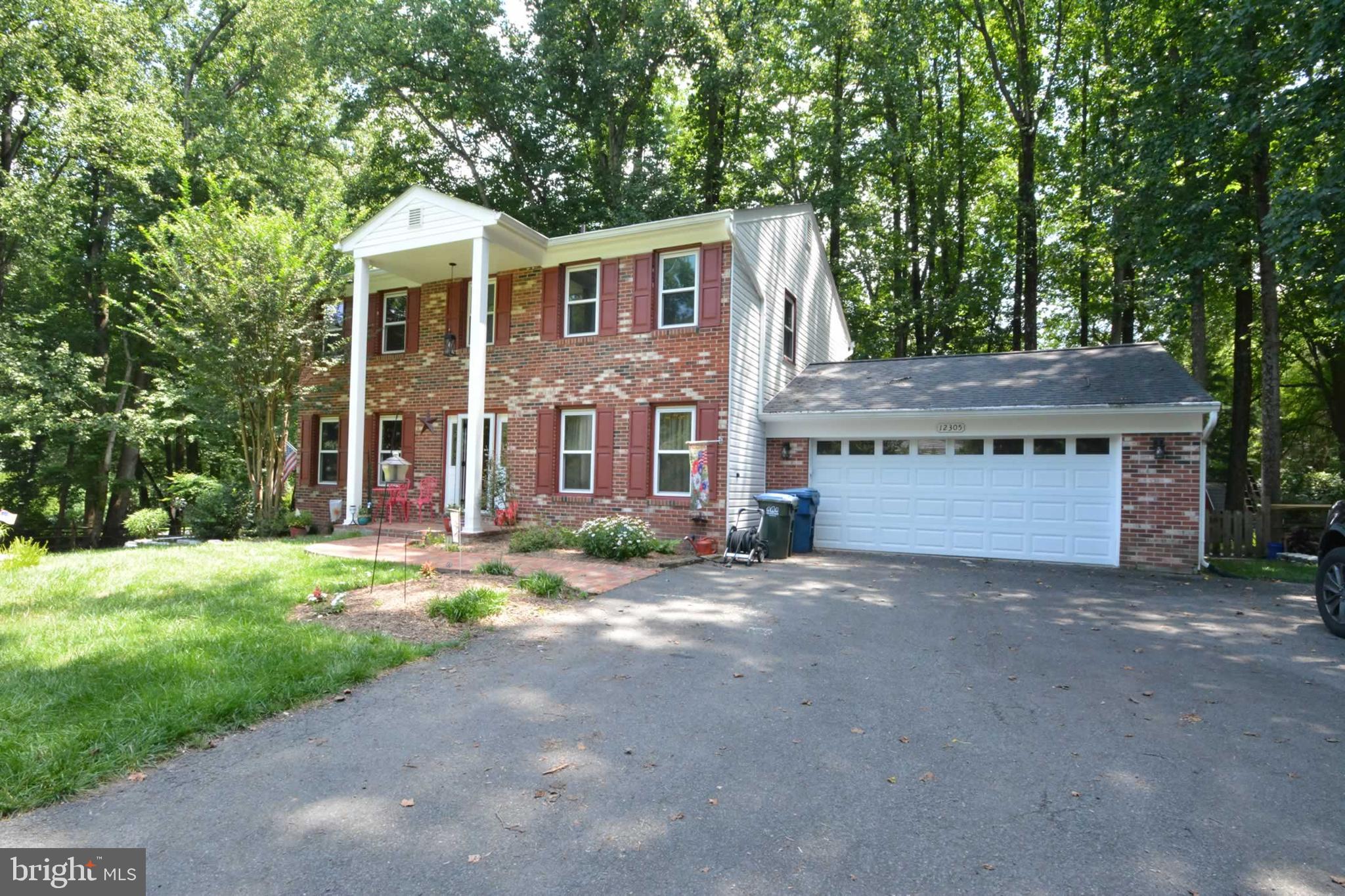 Experience Tranquil Living in the Heart of Northern Virginia
Welcome to this beautifully upgraded colonial home, nestled on nearly half an acre in the serene Folkstone community. Located near the end of Westwood Hills, this property offers exceptional privacy and peace.
From the moment you arrive, you’ll be greeted by a meticulously maintained lawn and a fully renovated exterior. Recent upgrades include a new roof, 6” gutters with leaf guards, siding, windows, and a sliding glass door—ensuring worry-free living (see full list of upgrades in the documents section).
Step onto the covered front porch and enter a welcoming foyer that provides access to the formal living room, dining room, kitchen, and a convenient powder room. Hardwood flooring flows through most of the main level, while the formal living room features plush carpeting and elegant crown molding. The dining room showcases distinctive hardwood flooring, crown molding, and built-in, backlit cabinetry—perfect for displaying fine china or treasured collectibles.
The kitchen, accessible from the dining room, has been fully modernized with granite countertops, a tile backsplash, under-cabinet lighting, and a new sink and faucet. Stainless steel appliances complete this stylish and functional space. The kitchen opens to a cozy eat-in area and a spacious family room, where a masonry fireplace and pellet stove create a warm and inviting atmosphere during cooler months.
Upstairs, the primary suite and three additional bedrooms all feature ceiling fans for comfort. The primary bedroom includes 1 walk in and 1 closet near a dedicated vanity area. The en-suite bathroom, fully renovated in 2023, boasts a granite countertop, a tiled walk-in shower, and a sleek sliding glass door. The secondary bedrooms share a recently updated full bath with a tiled step-in tub, double vanity with granite countertops, and modern fixtures.
Step outside through a new Anderson sliding glass door to a large wraparound deck—ideal for entertaining or enjoying quiet moments. There is over 900 sq ft of connected deck! The hot tub offers a relaxing retreat, while the fenced backyard provides privacy and security for both family and pets. A spacious shed offers additional storage or can be transformed into a workshop.
The basement is 90% finished and includes a versatile room that can serve as a bedroom, office, or gym, with direct access to a full bathroom. A small unfinished area houses mechanical systems and offers potential for a workshop or extra storage. The home is fully hardwired with Cat 5E cabling, centralized in a network box in the basement.
Additional features include a one-car garage with a new door, interior access through a mudroom with a newer stacked washer and dryer, and a pull-down attic staircase leading to a floored, lighted storage area.