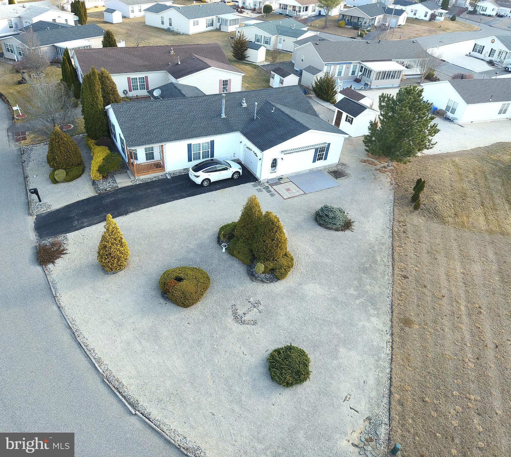 This is a must see. The Perry's Lake home offers 1800+ sqft of living space. Home is situated on a oversized lot. Come and enjoy adult living at its finest. Close to shopping ,schools and LBI beaches. This RANCHER offers living room with stone gas fireplace, dining room, eat in oversized kitchen, laundry room, oversized garage, shed, study(could be a 3rd bedroom) that opens into a all season room that has its own heat and ac. The master bedroom has walk in closet , soaking tub, walk in shower with plenty of room to accommodate king size bed with lots of wall space. 2nd bedroom is large as well with guest bathroom that has a tub/shower. There is even a shed and sun awning with a side patio surrounded by white rock for low maintenance. Perry's Lake homes are manufactured home with automobile titles with a land lease so there are NO TAXES but there is an association fee to cover the many lakes , lawns, snow removal and clubhouse and pool. Come enjoy vacation all year long. This will not last long.