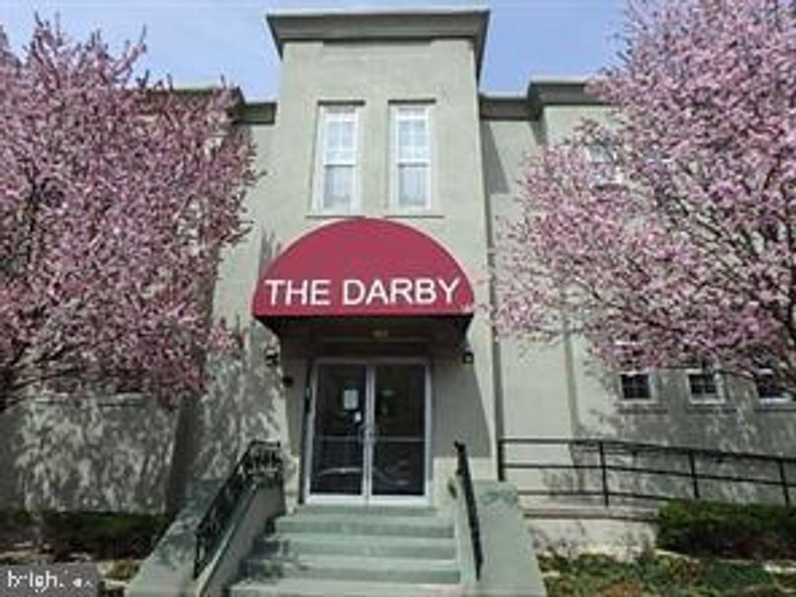 **Rare Opportunity in the Historic Darby Condominium!**
Enjoy the freedome of an entirely non-smoking building.
Welcome to this first-floor 2-bedroom condo in the secured Darby Condominium building—complete with a designated parking space inside the gated lot. This residence isn’t short on conveniences, offering **in-unit laundry** and a **tastefully designed kitchen** that maximizes every inch of space.
The Darby is a true gem in the City of Hagerstown, just **three short blocks from the Arts & Entertainment District**.  This stately building was transformed into stunning condos in 2006. Today, it offers 27 unique residences across three floors, with grand features such as **soaring ceilings, oversized stairways, and wide hallways** that reflect its historic character.
You’ll love the location—steps away from the **Maryland Theatre, Washington County Library, University of Maryland Global Campus,** and the **new Hagerstown Boxcars stadium**. Plus, the **Main Street Hagerstown Program** continues to revitalize the area, preserving historic architecture while welcoming new businesses, dining, and tourism attractions to “Hub City.”
**Highlights:**
* Secured entry building
* Fenced, private parking lot (1 assigned space)
* In-unit laundry
* Well-designed kitchen with efficient use of space
* High ceilings, wide halls, and grand stairways
* Walkable to dining, entertainment, and cultural attractions
*Water and trash included, tenant pays electric and cable/internet
**Note:** No animals permitted.