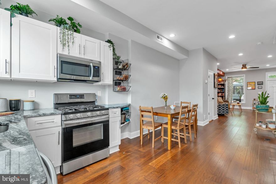 This stunning, fully renovated townhome features a desirable open floor concept and boasts several attractive features. As you enter the home, you'll immediately notice the abundance of natural light that illuminates the main level. The spacious living room showcases gleaming hardwood floors, creating a warm and inviting atmosphere. On the main level, there is also a convenient half bathroom.

The kitchen in this townhome is a highlight, offering granite countertops, ample storage space, a gas stove, and stainless steel appliances. It is both functional and aesthetically pleasing, providing a great space for cooking and entertaining. Moving to the upper level, you'll find three bedrooms, each adorned with wall-to-wall carpeting and freshly painted walls. The lower level of this townhome is perfect for entertaining guests or creating a cozy family space. It features a spacious family room where you can gather and relax. Additionally, a fourth bedroom can be used for guests, as an office, or any other purpose you desire. This level also provides access to another full bathroom.

The fenced yard also offers additional privacy and provides a barrier between your home and the outside world, allowing you to enjoy your outdoor space with peace of mind. Overall, this fully renovated townhome combines modern updates with functional living spaces, making it an excellent choice to call home.