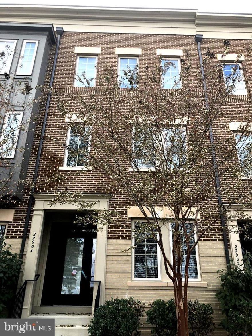 Welcome Home to this Lovely townhouse, 3bedrooms 2.5 baths. main  level features a bedroom/office work area  with full bathroom. Perfect for working at home or in-law suite. The mid level  is the living / dining area and Kitchen, powder room . Brick veneer interior walls create an interesting interior design. 9' high ceiling throughout and large windows bring in  plenty of light inside.
Oversized garage , entrance from rear of townhouse.
right across from the Brambleton Town Center  which has the library, Restaurants, and theater  and more..
Plenty of landscaped walking trails , Plenty of outside parking spaces and comfort and convenience as well as high quality life style.  Move- in Ready!