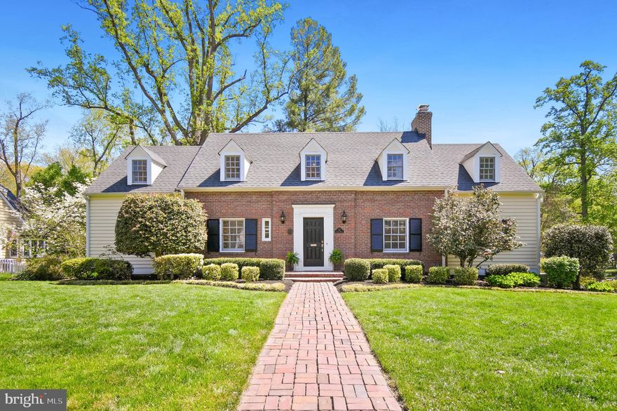 Gorgeous 4/5 bedroom, 3.5 bath expanded Cape Cod nestled on one of the prettiest streets in Falls Church City's Broadmont neighborhood. From the moment you arrive, the home’s exceptional curb appeal draws you in, while its true size of almost 6000 sqft of living space is pleasantly understated from the front. Thoughtful side and rear additions by both the current and previous owners seamlessly blend classic brick Cape Cod charm with the modern living spaces today’s buyers desire.

Inside, the home features four fireplaces (two gas and two wood-burning), adding warmth and character throughout. The formal living room welcomes you with a cozy gas fireplace, behind which the right wing of the home continues, offering a stately library or office complete with stunning millwork and abundant built-ins. The formal dining room exudes timeless charm, highlighted by beautiful wainscoting and built-in corner cabinets.

The kitchen is both stylish and functional, featuring painted cabinetry, a new oversized built-in refrigerator (2026), double wall oven, cooktop, island, and a spacious eat-in area. Just beyond, step down into the expansive, light-filled family room with a wood-burning fireplace and a full wall of built-ins—perfect for everyday living and entertaining. The main level also includes an updated half bath, laundry room with pantry space, and hardwood floors throughout.
Outdoor living is just as impressive. The 23’ x 16’ mahogany wood screened porch offers two levels to comfortably accommodate both dining and lounging areas, with access from both the living and family rooms. A large deck spans most of the back of the home, creating a seamless indoor-outdoor experience. 

Upstairs, the spacious primary suite features a vaulted ceiling, private balcony, and an en suite bath with soaking tub, tiled shower, 2 sinks, and walk-in closet. Classic Cape Cod details shine on the upper level, including charming dormer window benches with custom cushions.  Rounding out the top level are three additional bedrooms and a hall bathroom that has recently undergone an upscale full renovation. 

The lower level provides incredible additional space, including a large tiled mudroom with bead-board accents that doubles as a flexible area for games or reading, complete with the third fireplace. The newly carpeted recreation room features built-ins, a wall of windows and a fourth fireplace. This level also includes a bonus room or optional fifth bedroom with a walk-in closet. A full bathroom, and ample utility and storage space complete this level.

A unique garage setup offers both a large, attached one-car garage under the screened porch and additional climate-controlled storage in the original garage space.

Set on a beautifully landscaped, wide lot, this home offers an unbeatable location—featuring Falls Church City award-winning schools, surrounded by tree-lined streets and parks, and less than one mile from East Falls Church Metro, downtown Falls Church City’s shops and restaurants, Whole Foods, and The State Theatre.