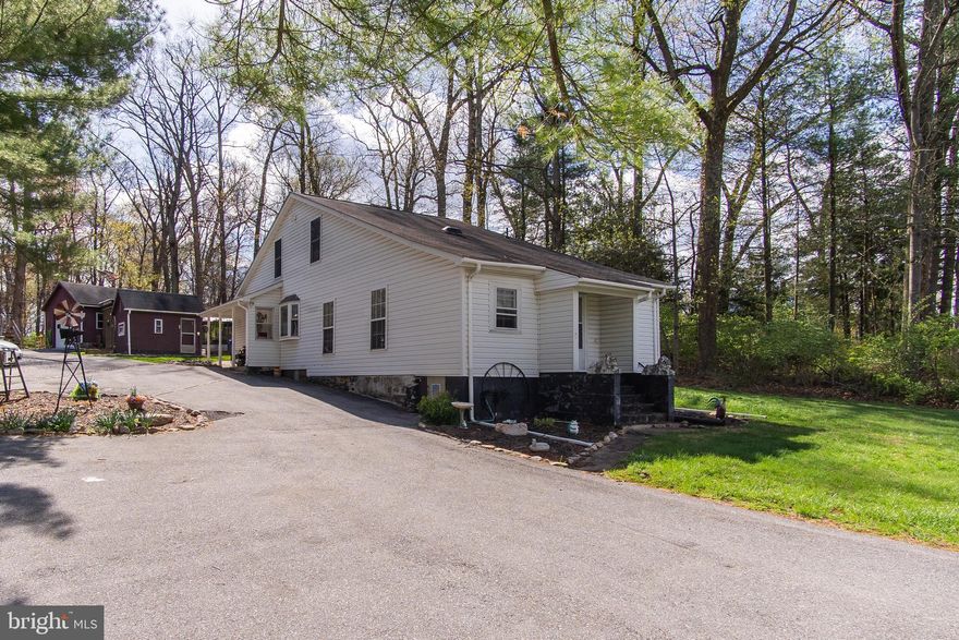 Welcome to this adorable 3br/2bath Cape Cod! This property has two bedrooms and one full bath on the main level, and the master bedroom with a full bathroom upstairs. All bedrooms are carpeted. The bathrooms, kitchen and laundry room have ceramic tile flooring. The remainder of the house has hardwood flooring. All of the fixtures in the home have been updated as well. The heat pump and Air conditioning were replaced in 2018, and this home also has new plumbing and electric! The shed in the back yard could be used as a hang out because it is fully insulated, and has carpet, as well as electric and has a separate electric box which also runs the garage and carport. There is a nice  fire pit patio area to enjoy cool summer or fall nights. There is also a Ring floodlight camera installed on the peak of the roof facing the driveway that will convey with the property. This home has had a lot of facelifts and updates since it was originally built in 1930. The pool liner and pool pump will need to be replaced. The septic is in need of repairs or replacement. Home is being sold AS IS.