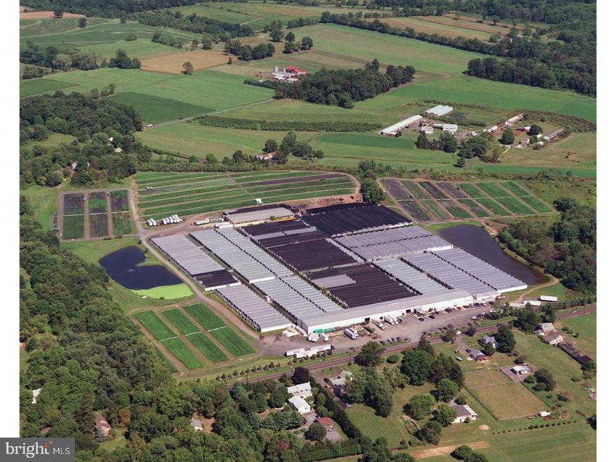 Remarkable 52+ Acres available in Buckingham Township.  With 13 acres of greenhouse, 14 acres of parking and 28,500 sq. ft. of warehouse operating with chillers, office space, 6 loading docks; 4 operating wells service the property; the possibilities are endless here. An existing business concern is leasing the facility.  This parcel, in the process of being created, will excludes the existing farmhouse and barn at the far end of the property.  Sellers have drawn plans for septic.  This is truly a unique opportunity.