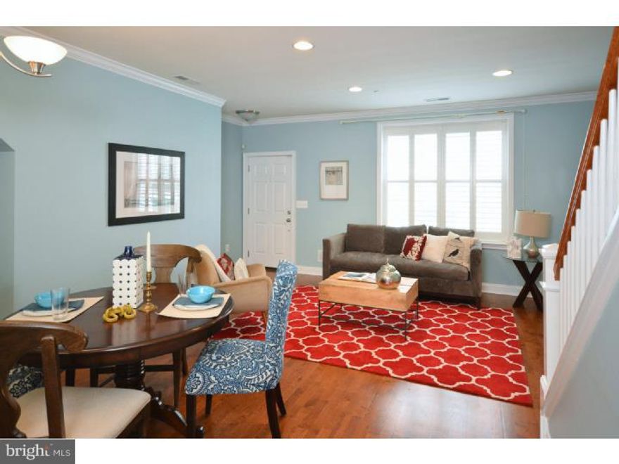 Exceptional opportunity at Naval Square: rarely available, 2-story, END UNIT Hartley townhome w/ private entrance, attached GARAGE &  terrace!  Situated in a picturesque, quiet landscaped courtyard, home features 9' ceilings, substantial moldings, custom paint & plantation shutters. Extensive lighting upgrades and oak hardwood flooring. 1st floor: living/dining room combo, 1/2 bath, spectacular custom kitchen w/GE Profile appliance suite, cherry, shaker-style cabinetry, large pantry & granite counters. 2nd floor: master suite w/ huge walk-in closet, luxe bath w/ dual sinks and upgraded tile. 2 bedrooms, side-by-side laundry closet and shared hall bath complete the 2nd level.Private terrace runs entire width of home. Ample storage space with built-in shelving located in garage. All this w/ legendary Naval Square amenities:  20-acre park-like setting, concierge, state-of-the-art ?tness center, seasonal saltwater pool, dramatic common spaces, gated community!  Close proximity to South St Bridge, PENN, CHOP, HUP, Fitler and Rittenhouse Sq's and Schuylkill River Park. Sought-after location for graduate students, faculty and residents. Better than new home, app. 7 years remain on tax abatement, very low utilities and condo fees.