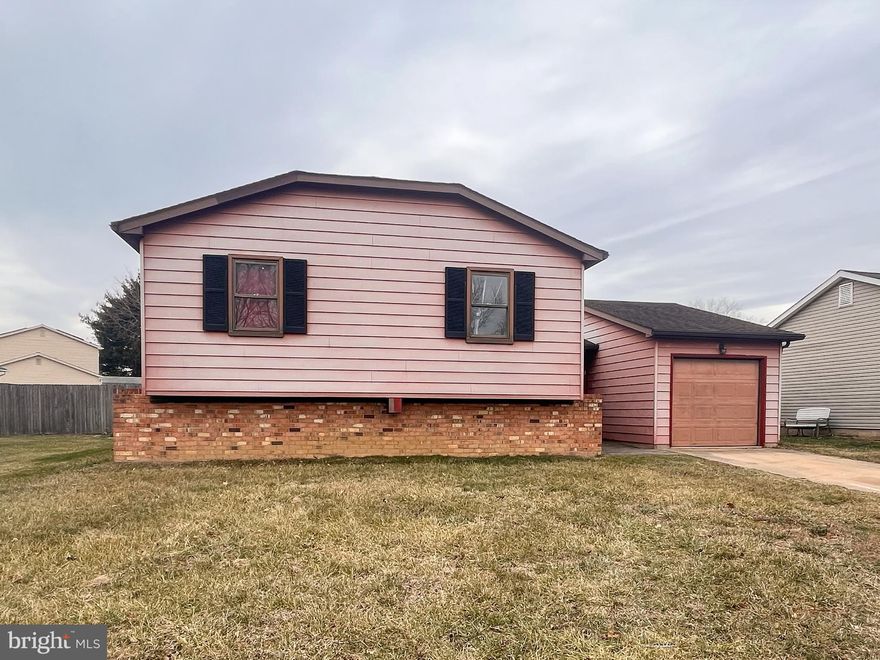 Investor or handy owner occupant alert. Welcome to 16 Courtland Circle, a 3 bedroom, 2.5 bath raised ranch located in the established Buckley community of Bear. Offering approximately 1638 square feet of finished living space, this home presents a solid opportunity for buyers looking to renovate, add value, or create a personalized living space. The concrete driveway comfortably accommodates two vehicles and leads to the front entrance accented by paver detailing. The level, fenced-in yard is open and easy to maintain, complete with a storage shed for added convenience. An attached one car garage provides additional parking or storage options, and the 30 year architectural roof shingles have plenty of estimated lifetime left. Inside, the main living area features an open concept layout with vaulted ceilings, creating a spacious feel and a strong foundation for future updates. The living and great room areas are ready for your vision. The kitchen includes vinyl flooring, marble-look countertops, white cabinetry, and a brick backsplash, with the dining area located just off the kitchen and offering overhead lighting and a large window for natural light. The primary bedroom features carpeting, a large window, and generous closet space. Additional bedrooms are well sized with adequate closets. The hall bath includes a tub and shower combination and a functional vanity, needing some TLC. The large basement offers excellent storage, full bathroom, laundry area, and Bilco door access to the fenced rear yard, with potential to be finished for a 4th bedroom and/or additional living space. Conveniently located near shopping, restaurants, and major routes, this property offers strong upside in a desirable location. While the home requires repairs and updates, the footprint, lot, and location make it a worthwhile investment opportunity.