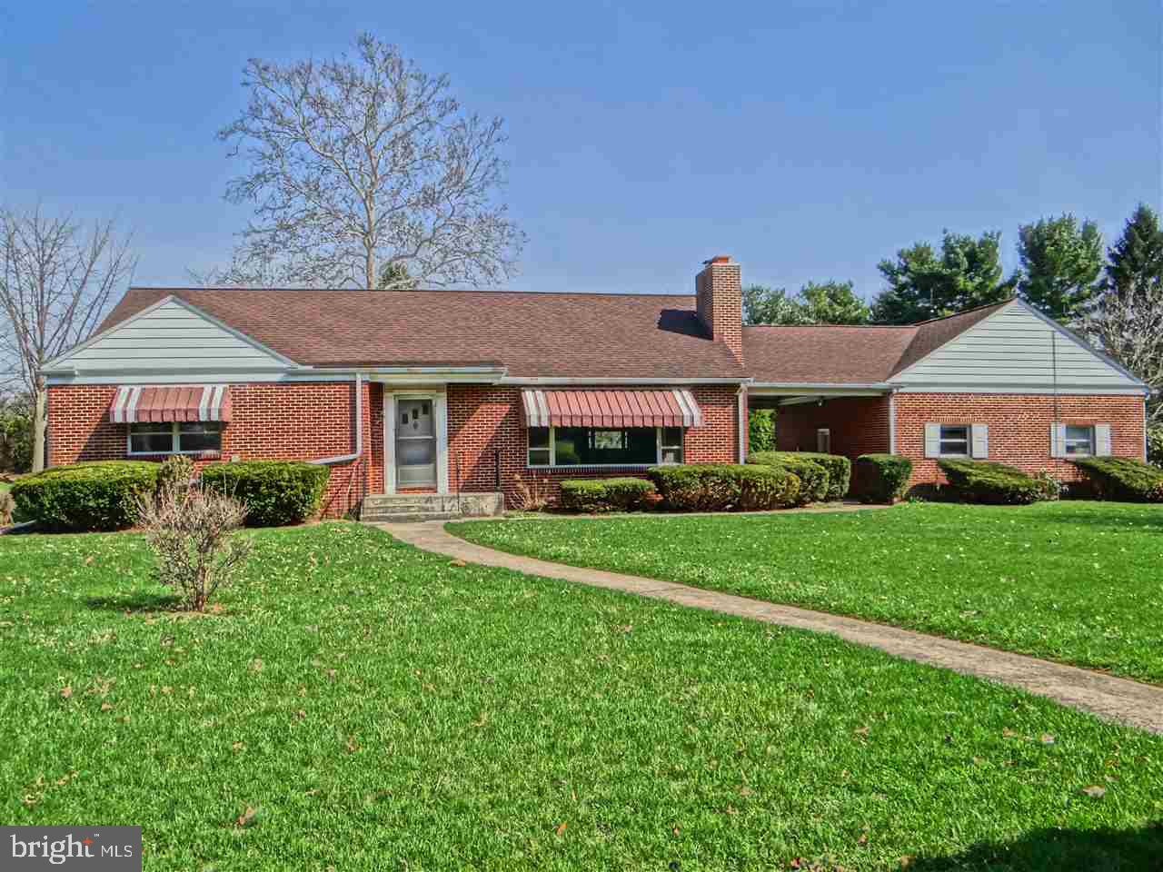 Enjoy a brick ranch home located conveniently to I-81 and Rt. 11, on a beautiful 1.01 acre parcel with views of the golf course. Includes large rooms; formal living and dining room, cherry floors throughout and lower level bonus room with laundry and full bath.Kitchen with automatic picture window above sink. Large 2 car garage and vinyl fenced yard. Attic space is perfect for storage or finish it off for extra bedrooms!