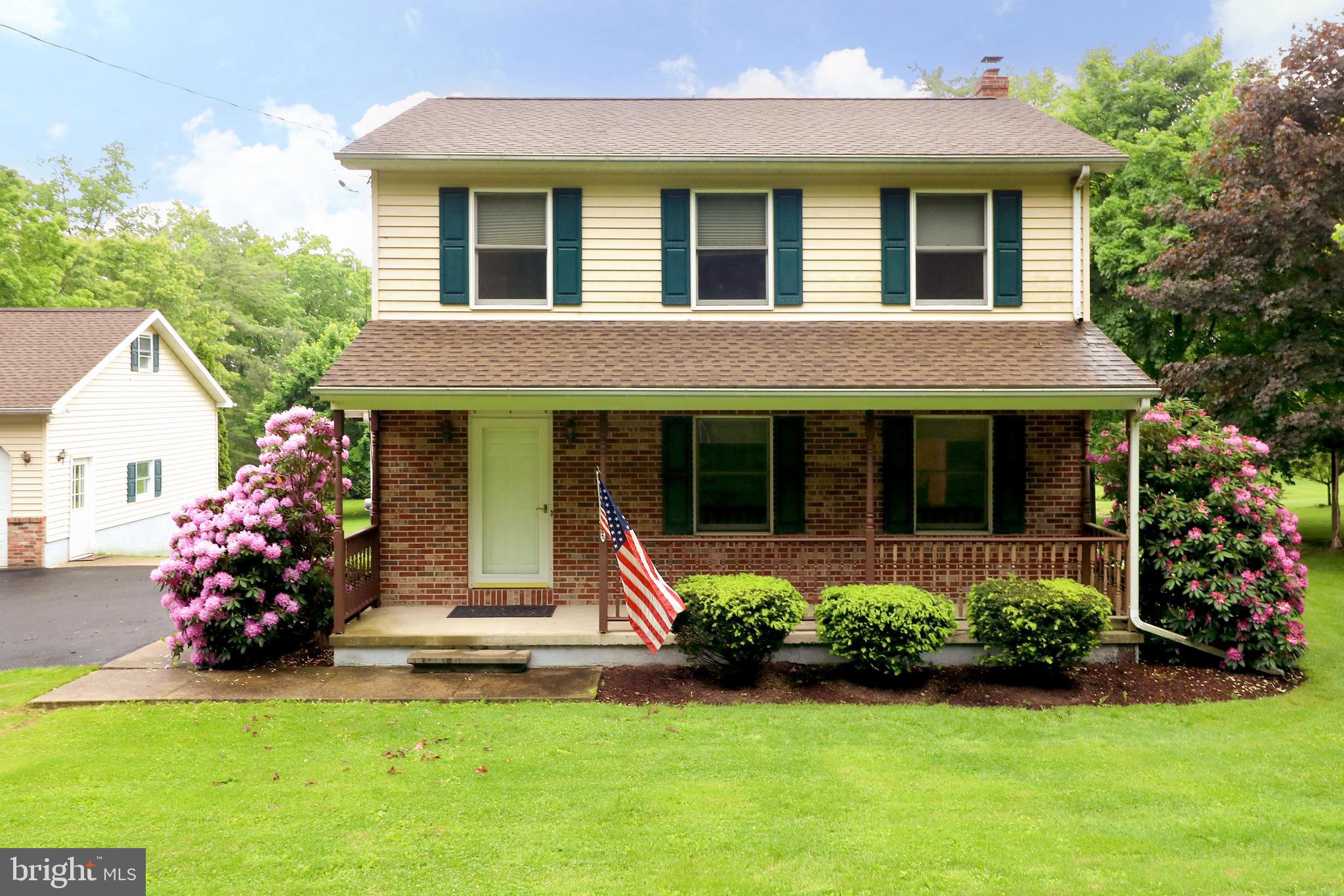 Positioned at the foot of Bressler Gap Mountain in the serene Penns Valley, this stunning property sprawls over 1.38 acres, offering a perfect blend of nature and modern living. As you approach the house, you'll be greeted by a partially covered deck inviting you to enjoy the tranquility of your mostly flat backyard, with vibrant peach and apple trees and flourishing blueberry bushes. Step inside to discover an oversized eat-in kitchen, featuring an island/bar that’s perfect for gatherings. The engineered hardwood floors in the living room exude warmth and elegance, creating a welcoming atmosphere. Upstairs, you will find three sizeable bedrooms that provide ample space for relaxation. The full bath has been thoughtfully updated with a new shower, while the home also boasts a newer water heater for added convenience. The partially finished heated basement offers extra storage options. You will also be able to supplement your electric heat with a wood stove located in the basement. The property’s utility is further enhanced by an oversized three-car garage, complete with a pit and extra storage above. This garage is equipped with hot and cold water, and it features a chimney set up for a stove, providing another layer of functionality. Convenience is at your fingertips, as the home is just minutes away from local grocery stores, hardware shops, cozy restaurants, coffee boutiques, and a doctor’s office—everything you need is close by! With State College and Penn State University only 20 miles away, enjoy the peaceful retreat of country living without sacrificing accessibility. Both the detached garage and the house come with newer roofs, ensuring peace of mind for years to come. Don't miss out on this unique property that offers so much potential in a beautiful setting.