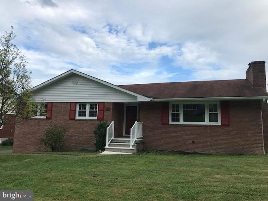 Beautifully updated brick rancher - new kitchen cabinets,  granite counter tops,  stainless steel appliances, updated baths, large basement family room w/tile flooring, bar area, and new bath/laundry room.  Come take a look, the list goes on and on!