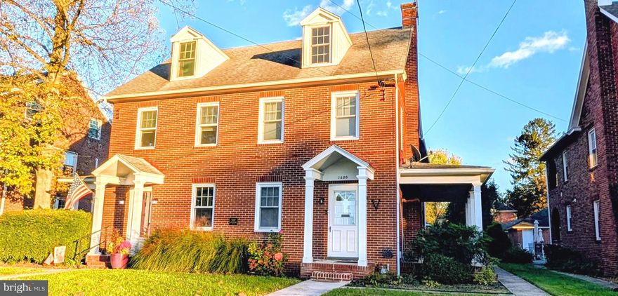 PRIME North End Location!   Warm welcoming , spacious all brick two story home.  Move-in ready with gorgeous hardwood floors. Features 4 bedrooms, 2 full baths, and updated kitchen appliances. Enjoy quiet evenings on the side porch and a pretty yard. Full walk-up attic partially finished . Yet another large area for storage or could be finished. 1-car detached garage/shop off the rear alley.  Appliances convey