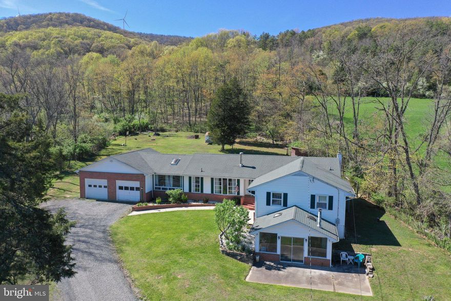 *BACK ON THE MARKET due to the buyer's home sale contingency agreement expiring!*   Looking for space? Looking for land? Look no further!!!! This beautiful rancher offers 4 bedrooms with 2 full baths on the main floor. The basement has an additional half bath, laundry area, and plenty of additional living space for entertaining, a home gym, bar or 2nd living room. 2.25 acres of land backing the mountains and a huge attached 2 car garage. Covered back patio area and large back yard that is great for entertainment.  Newer flooring throughout common areas upstairs with a nice dining area and additional space for a home office. Brand new heat pump/central air, water filtration system and well pump are all just over a year old. Check out the virtual tour!!