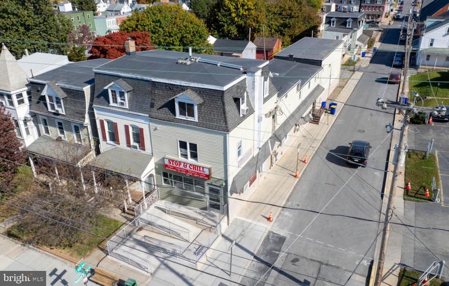 Investor Alert! Prime mixed-use property offering multiple revenue streams in a high-visibility location in York City. This fully leased building includes two street-level commercial units—Stop and Chill convenience store and a Micah's Cutting and Styling hair salon—providing strong, consistent rental income. The second floor features a well-maintained 2-bedroom residential unit with  reliable tenants who have been there since 2019.  Also include are five individual office spaces ideal for professionals or small businesses.

PLUS! an AT&T leased tower for easy additional rental income .  This is absolute ideal location nestled in North York boro, minutes from Route 30 and I83, close to downtown and 3 blocks away from the upcoming Wellspan Sport Complex.  Zoned for mixed use and located on a heavily trafficked corridor, this property presents a stable, income-producing asset with significant upside growth potential.